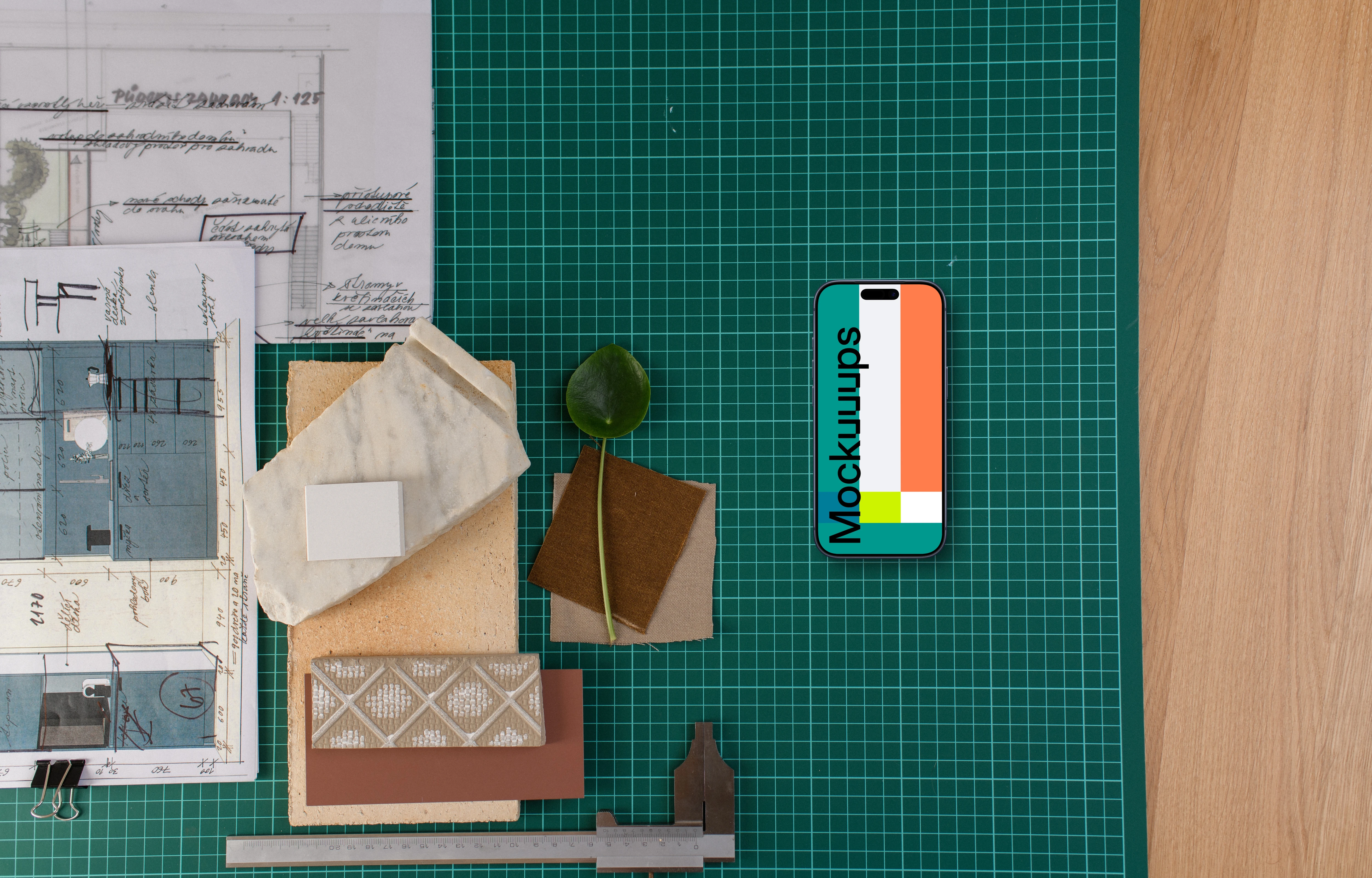 Smartphone mockup on architect's table