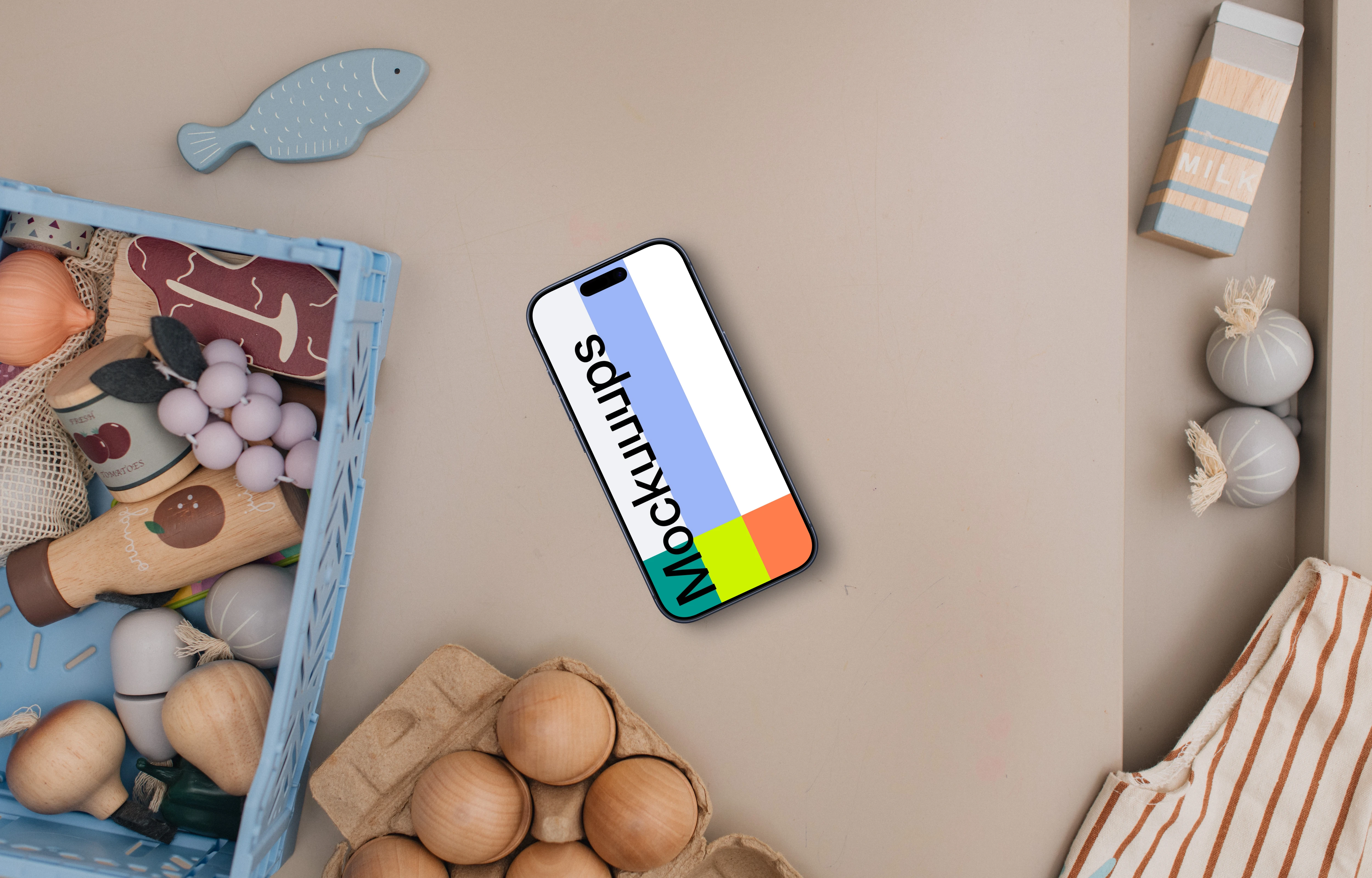 Smartphone mockup with kids' creative play items