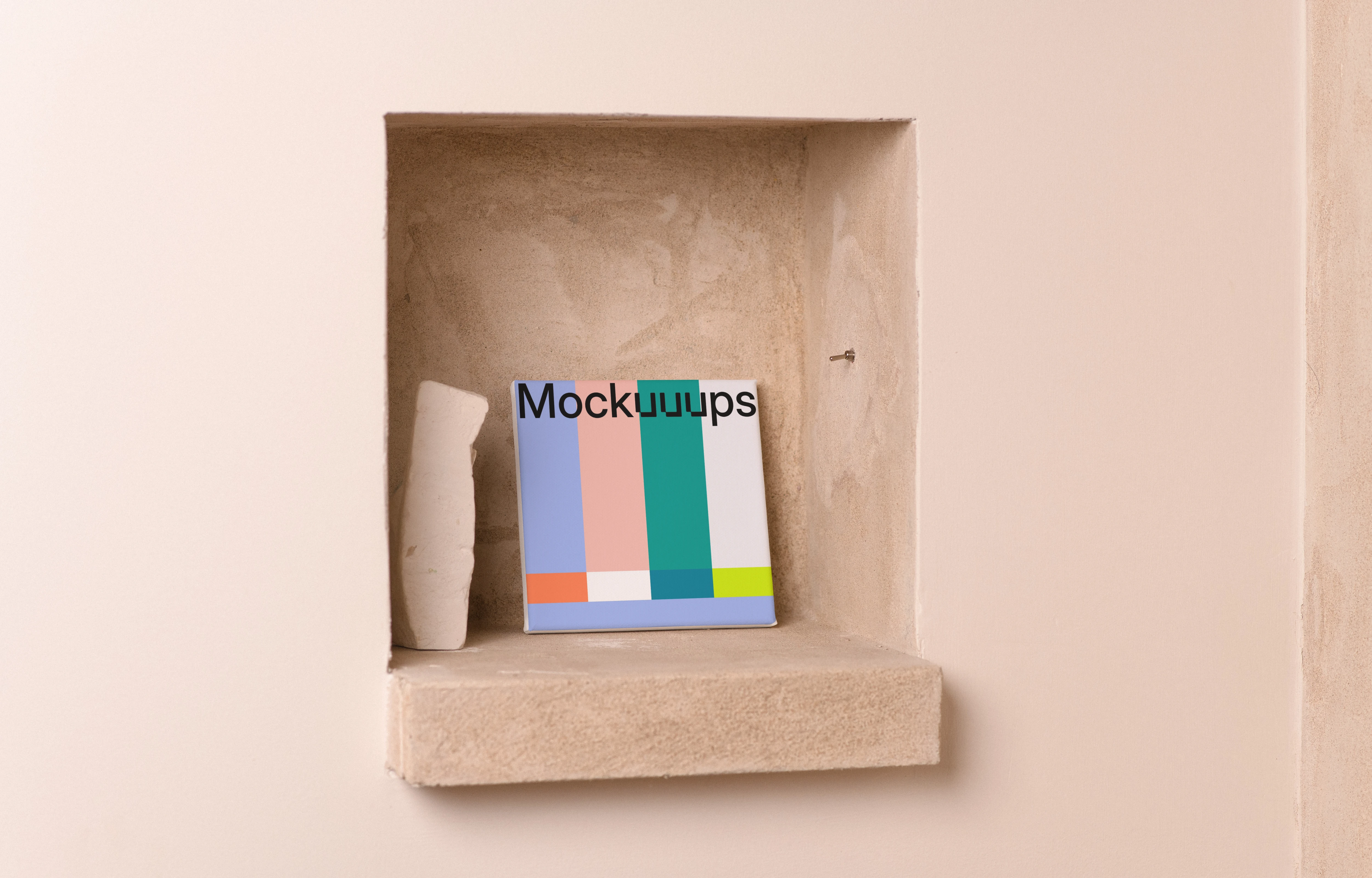 Square poster mockup on a beige recessed shelf
