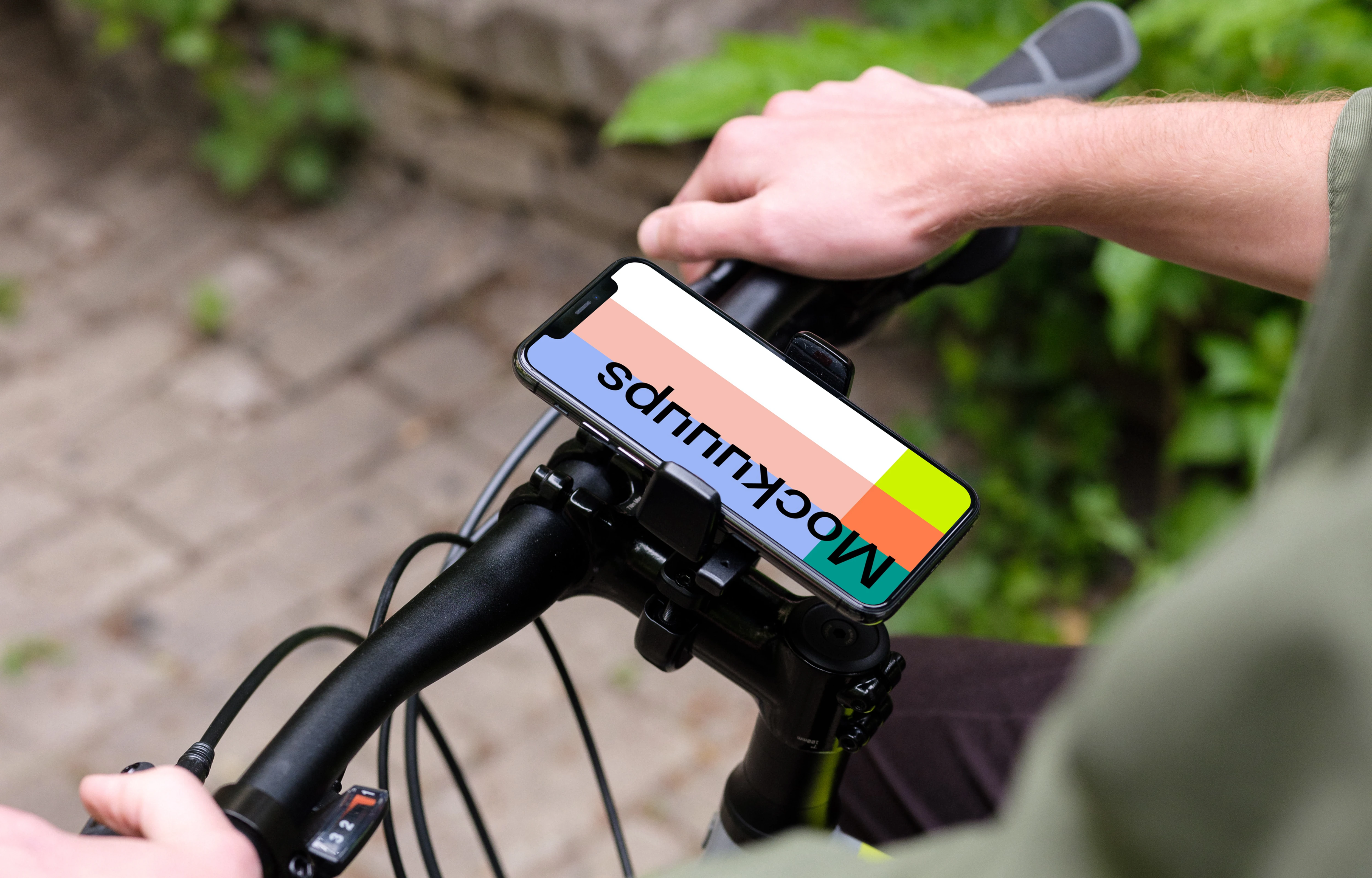 Standing on a bike with iPhone 11 Pro mockup in bike mount
