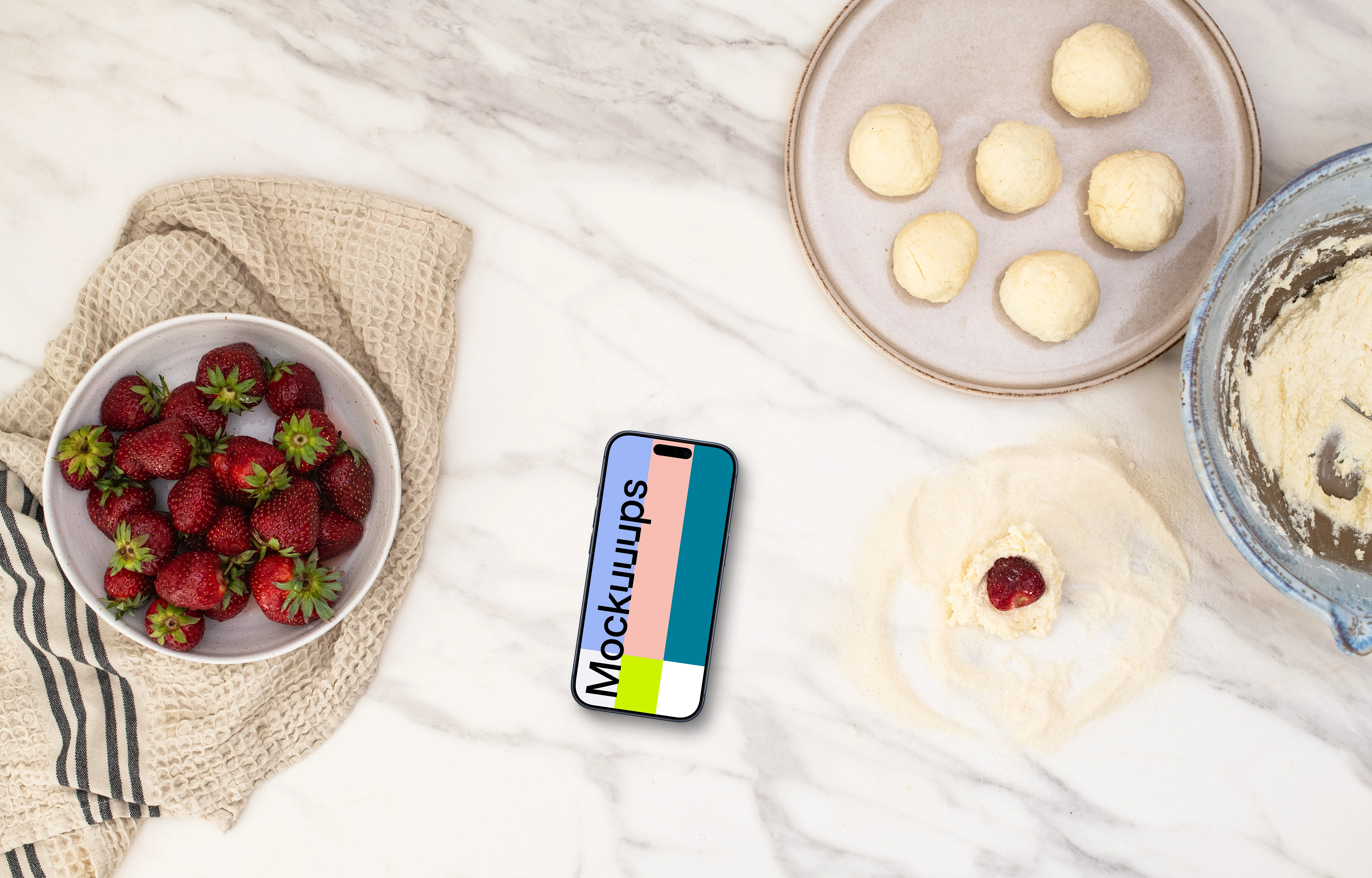 Strawberries and sweets next to the iPhone mockup