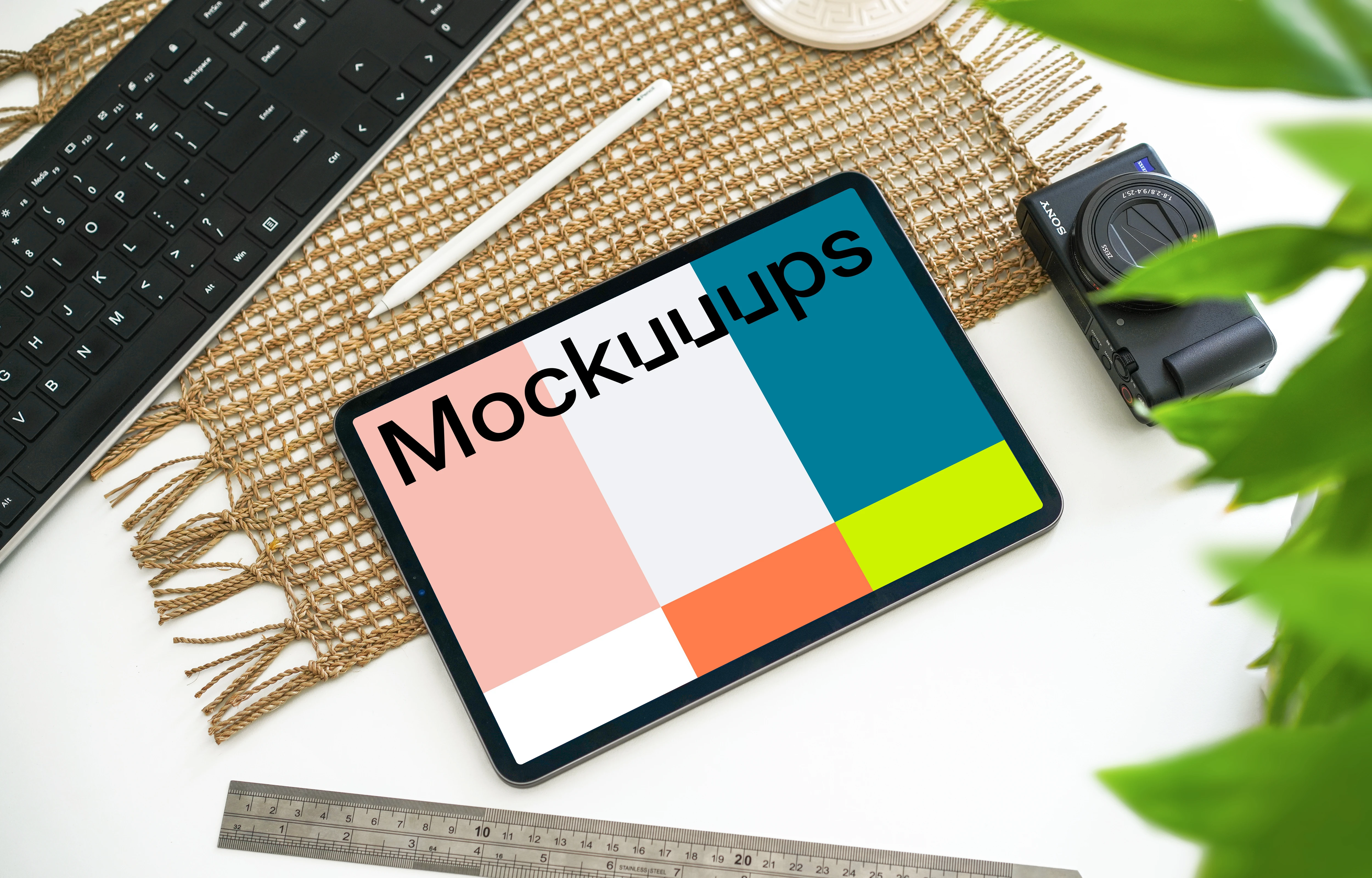 Tablet mockup beside a Canon camera