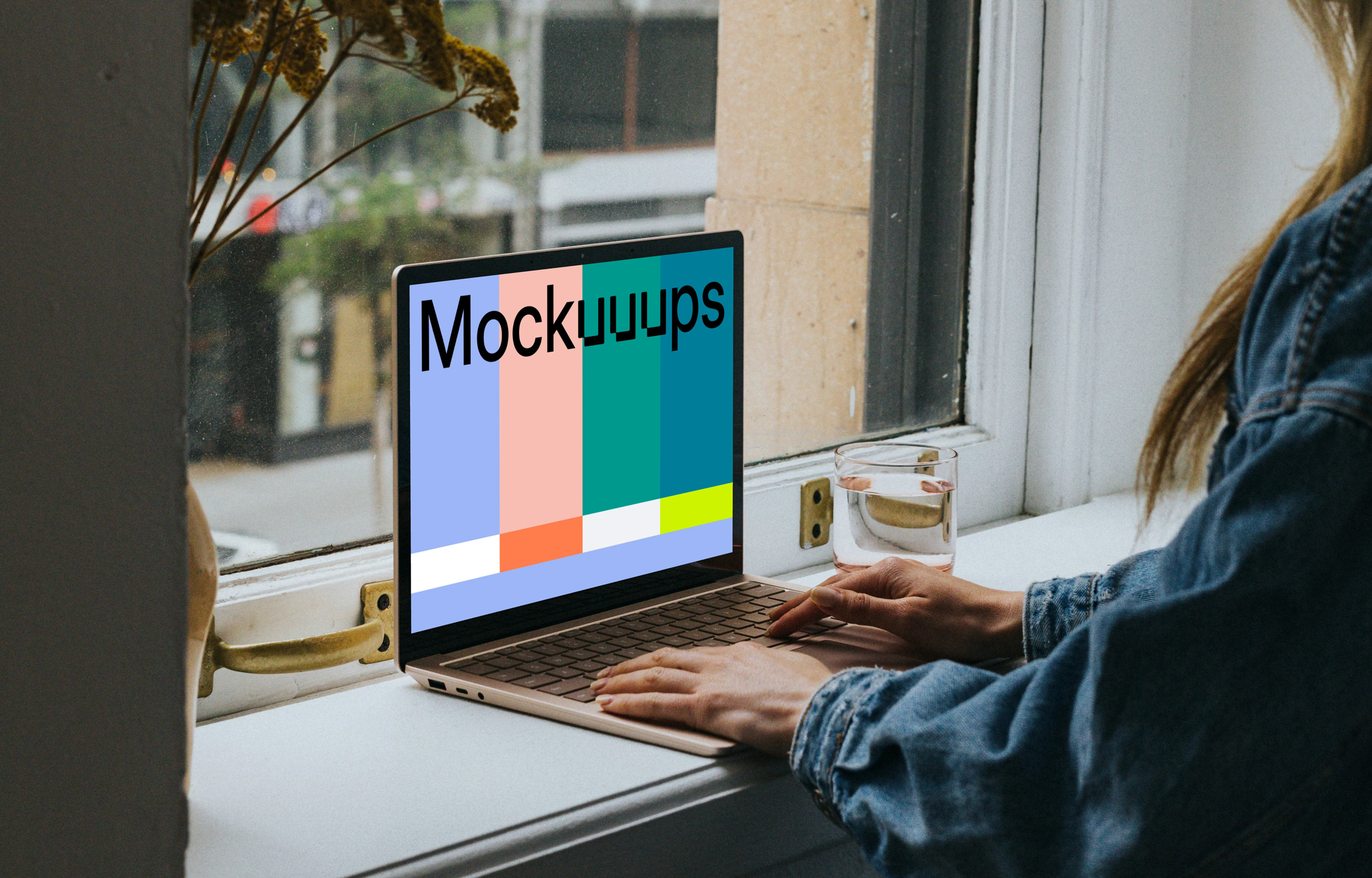 Woman sitting and working on the Microsoft Surface Laptop mockup