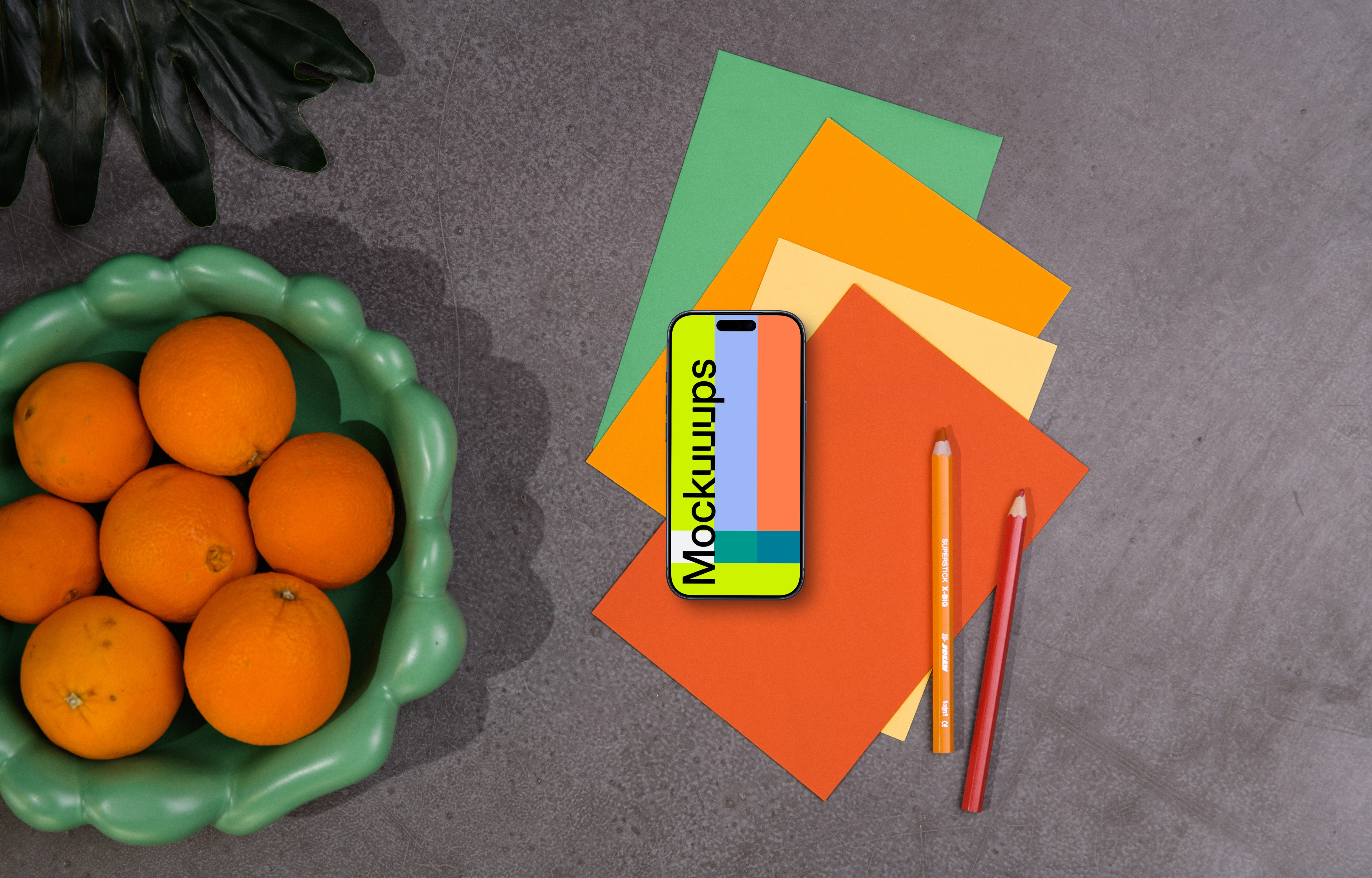 Smartphone mockup with colorful stationery and decor