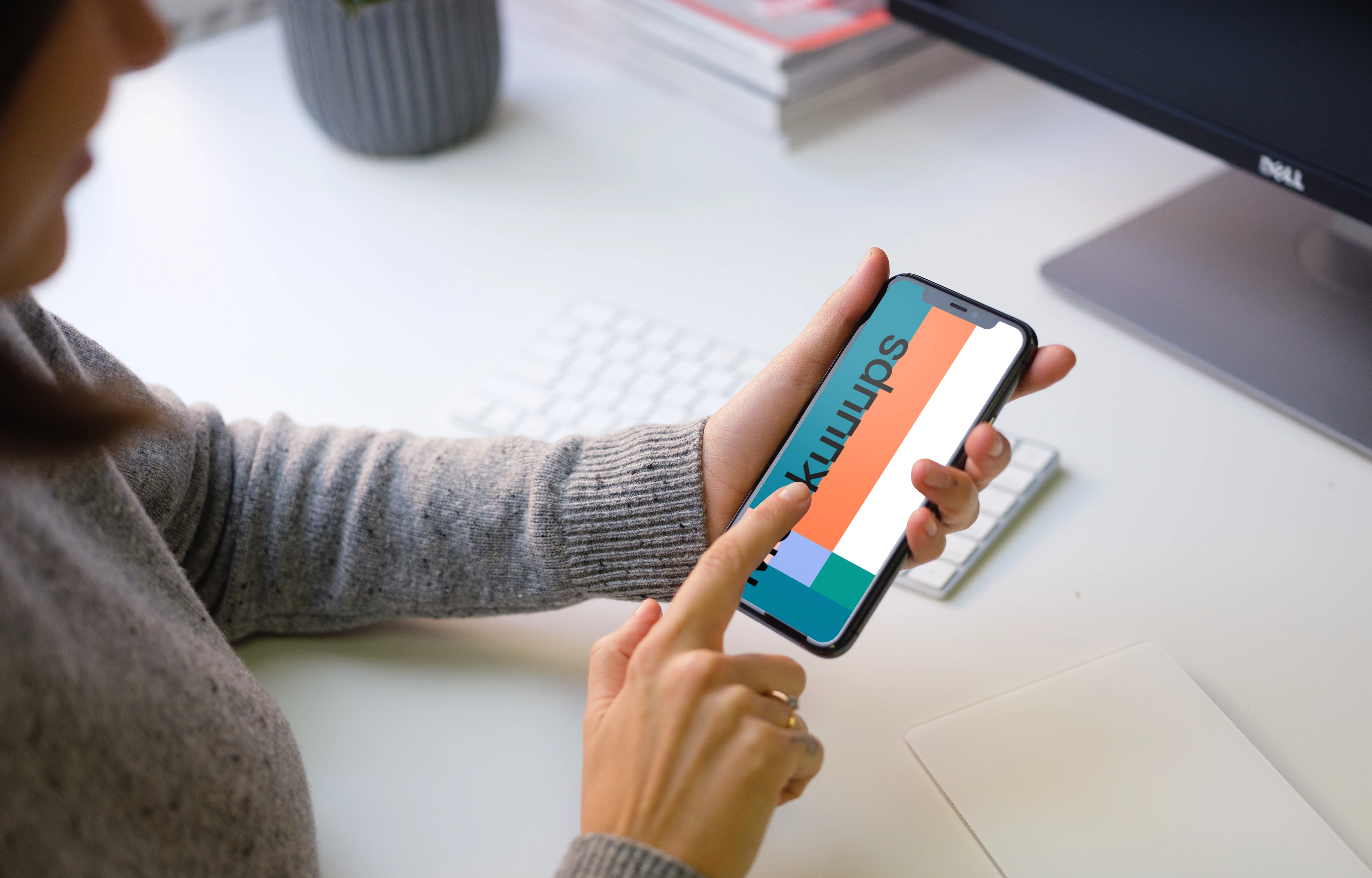 Young woman pointing on iPhone 11 mockup