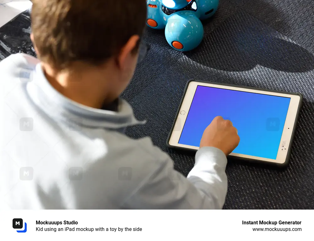 Kid using an iPad mockup with a toy by the side