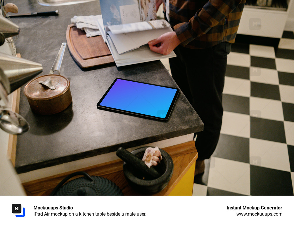 iPad Air mockup on a kitchen table beside a male user.
