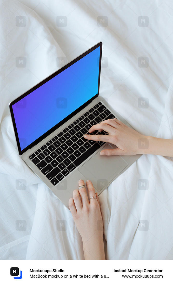 MacBook mockup on a white bed with a user typing on the laptop