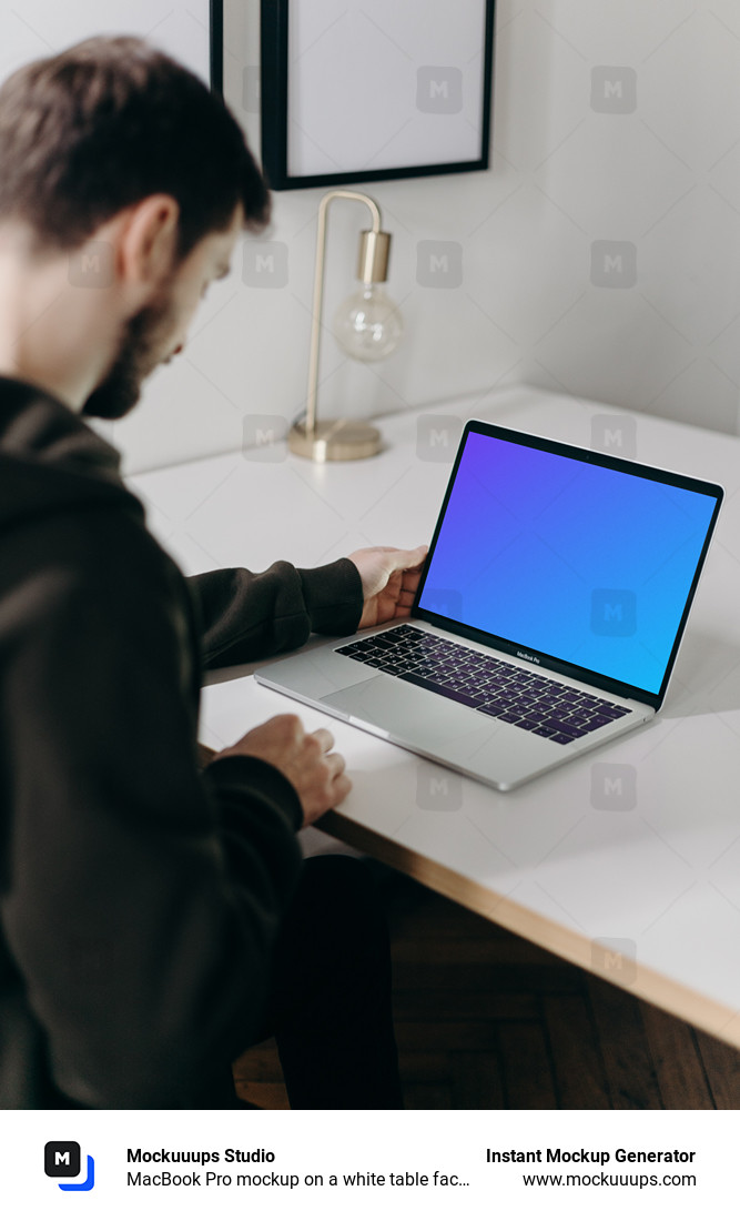 MacBook Pro mockup on a white table facing a mirror