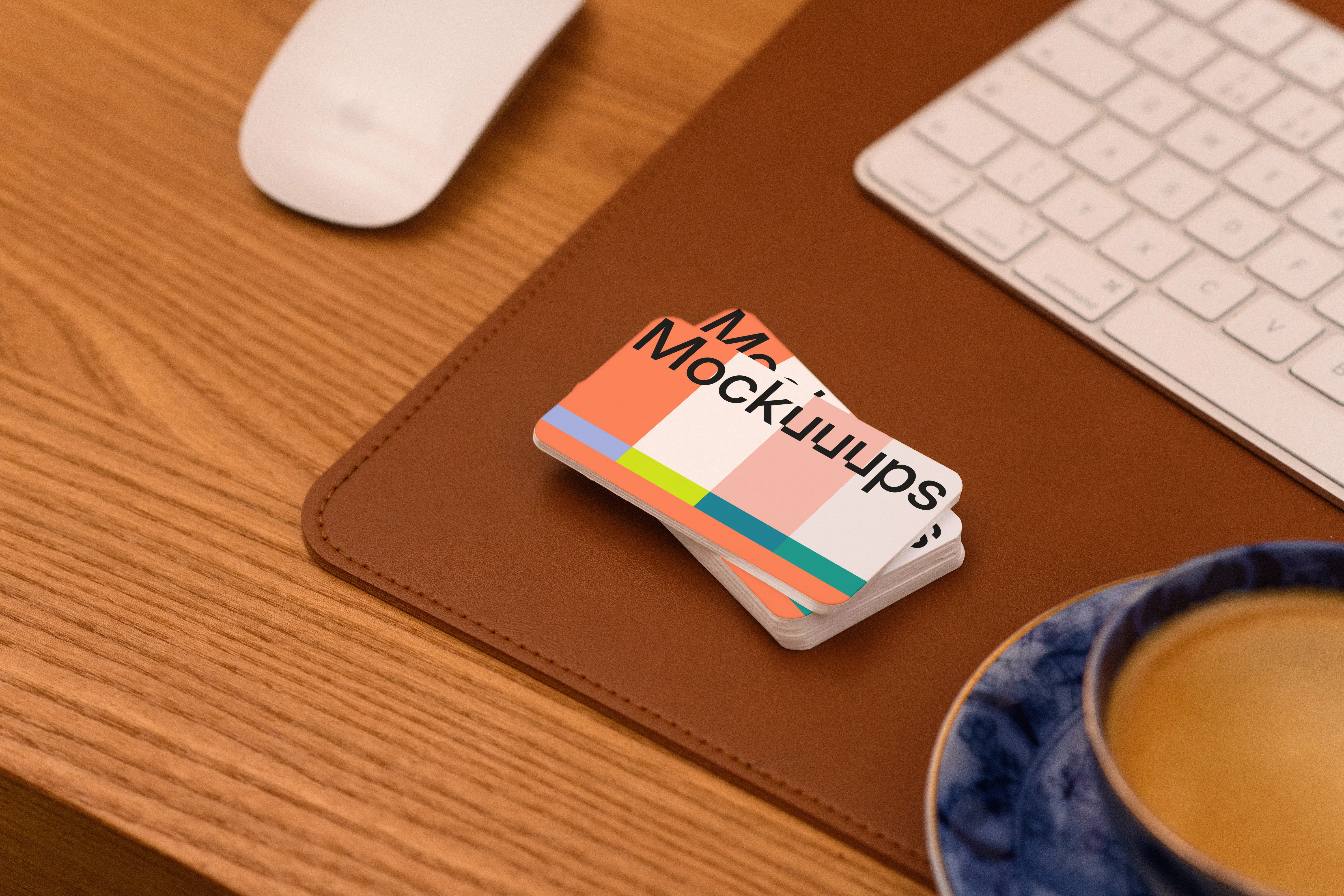 Business card mockup on a leather desk pad