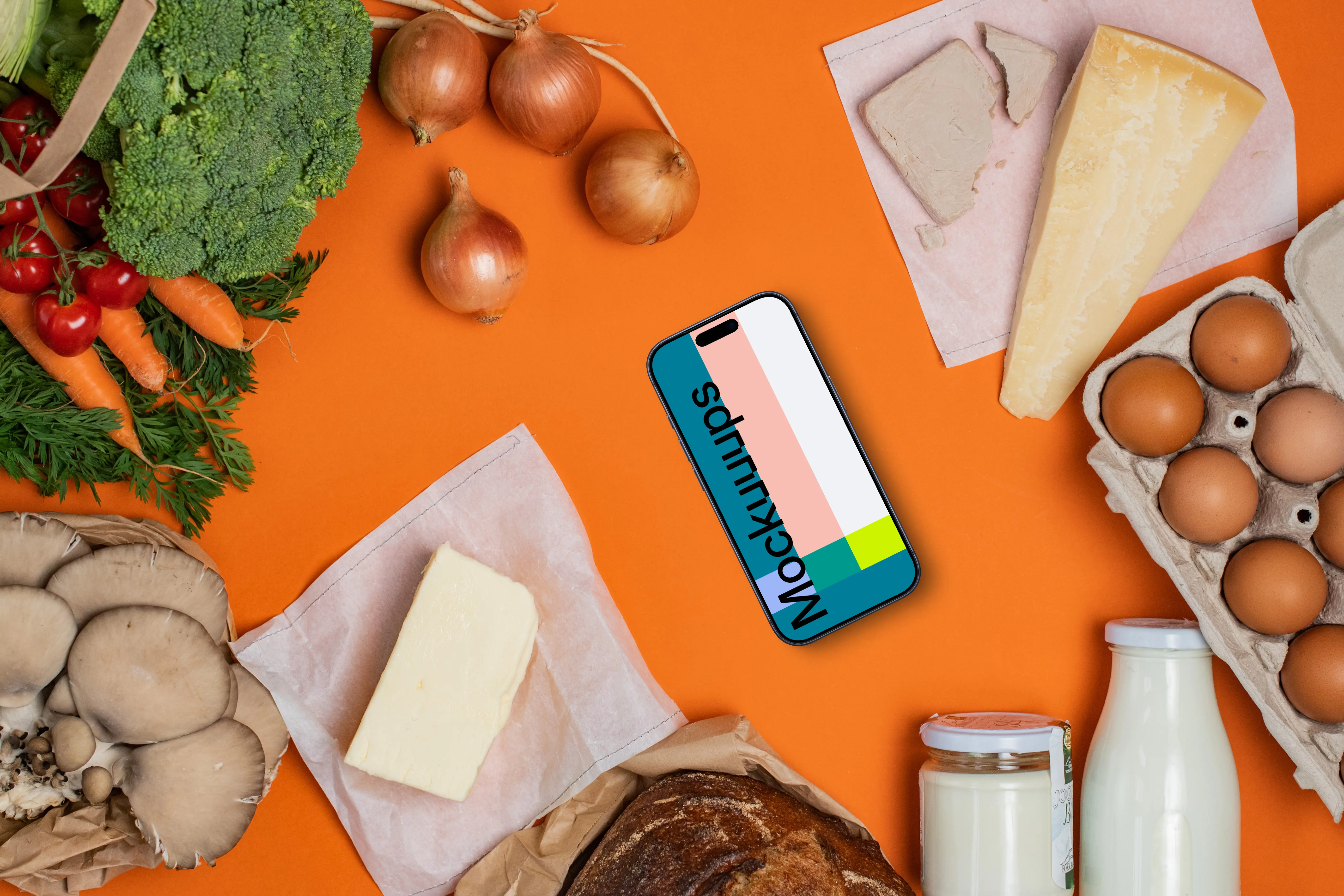 Device mockup in the middle of fresh groceries
