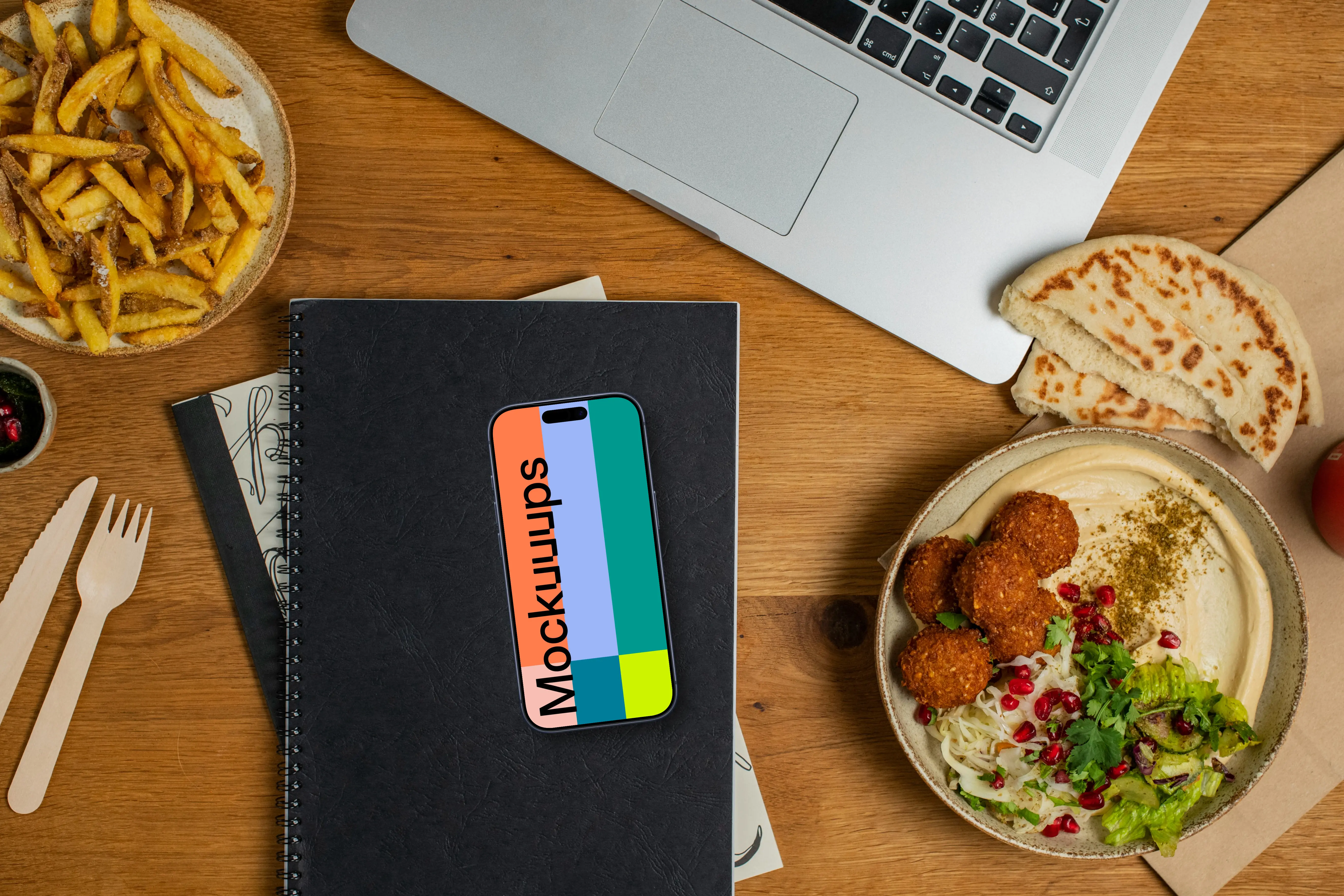 Falafel with hummus next to the Smartphone mockup