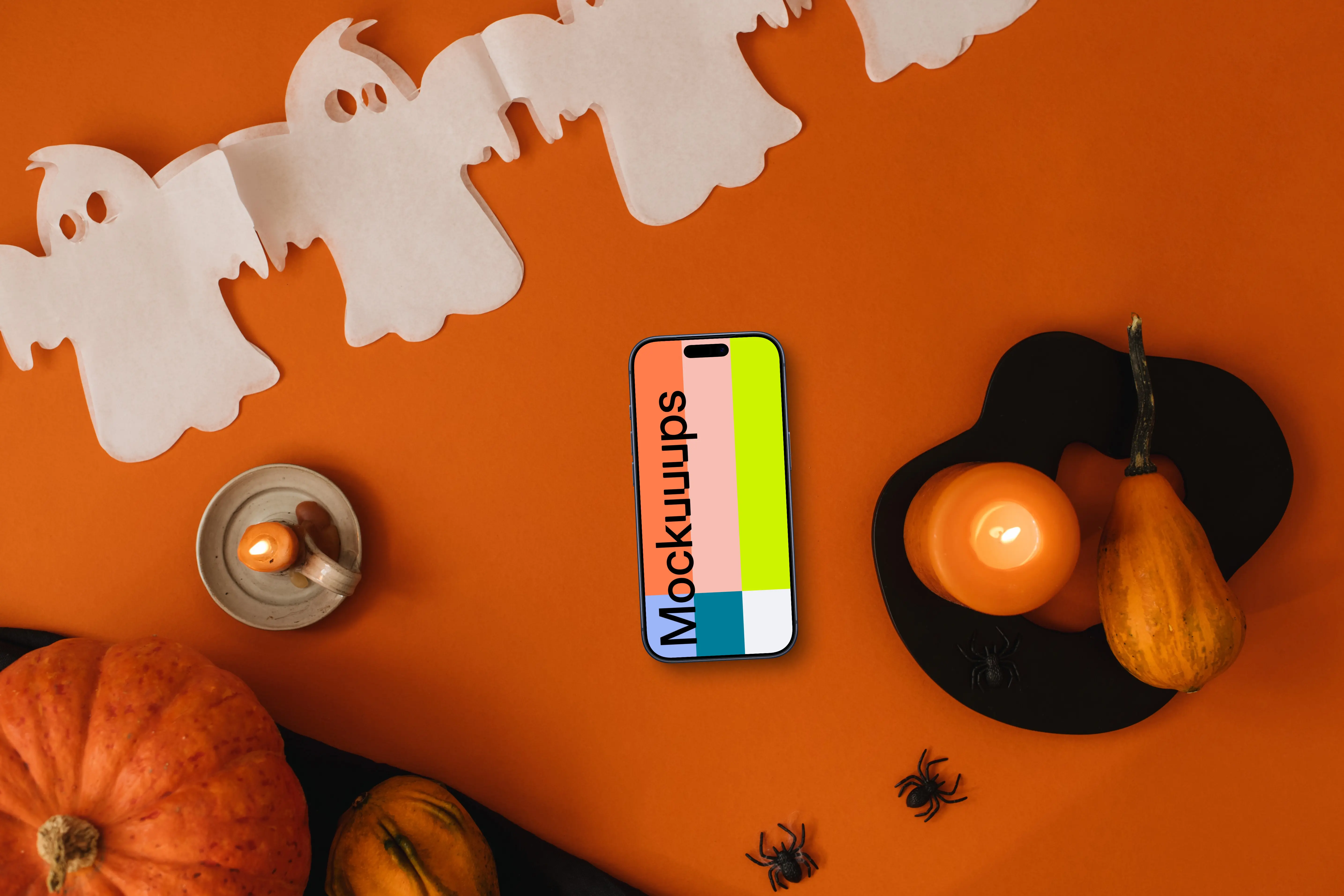 Halloween background mockup with a phone and pumpkin