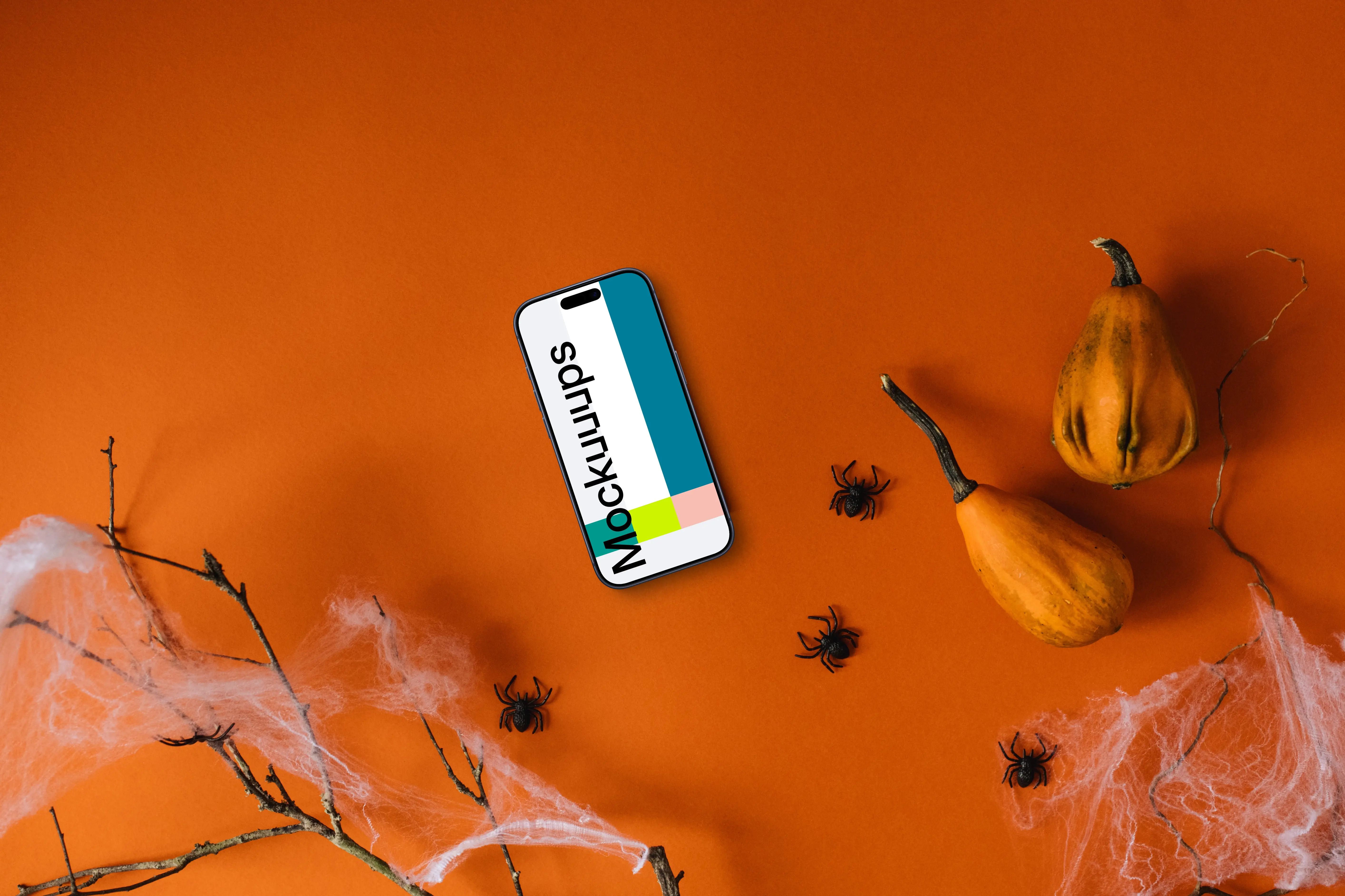 Halloween background mockup with a smartphone and spiders