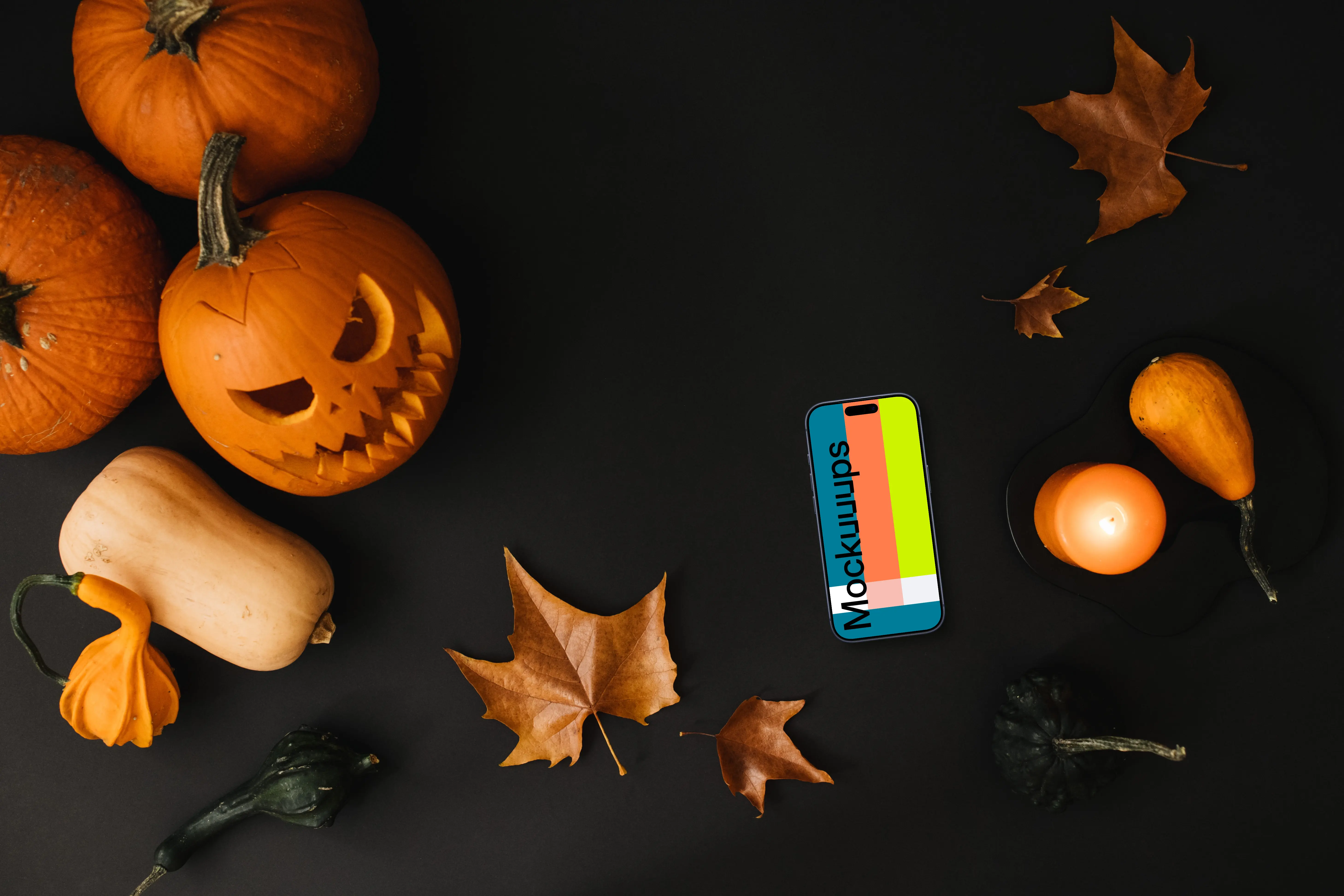 Halloween pumpkin mockup with a phone on the dark background