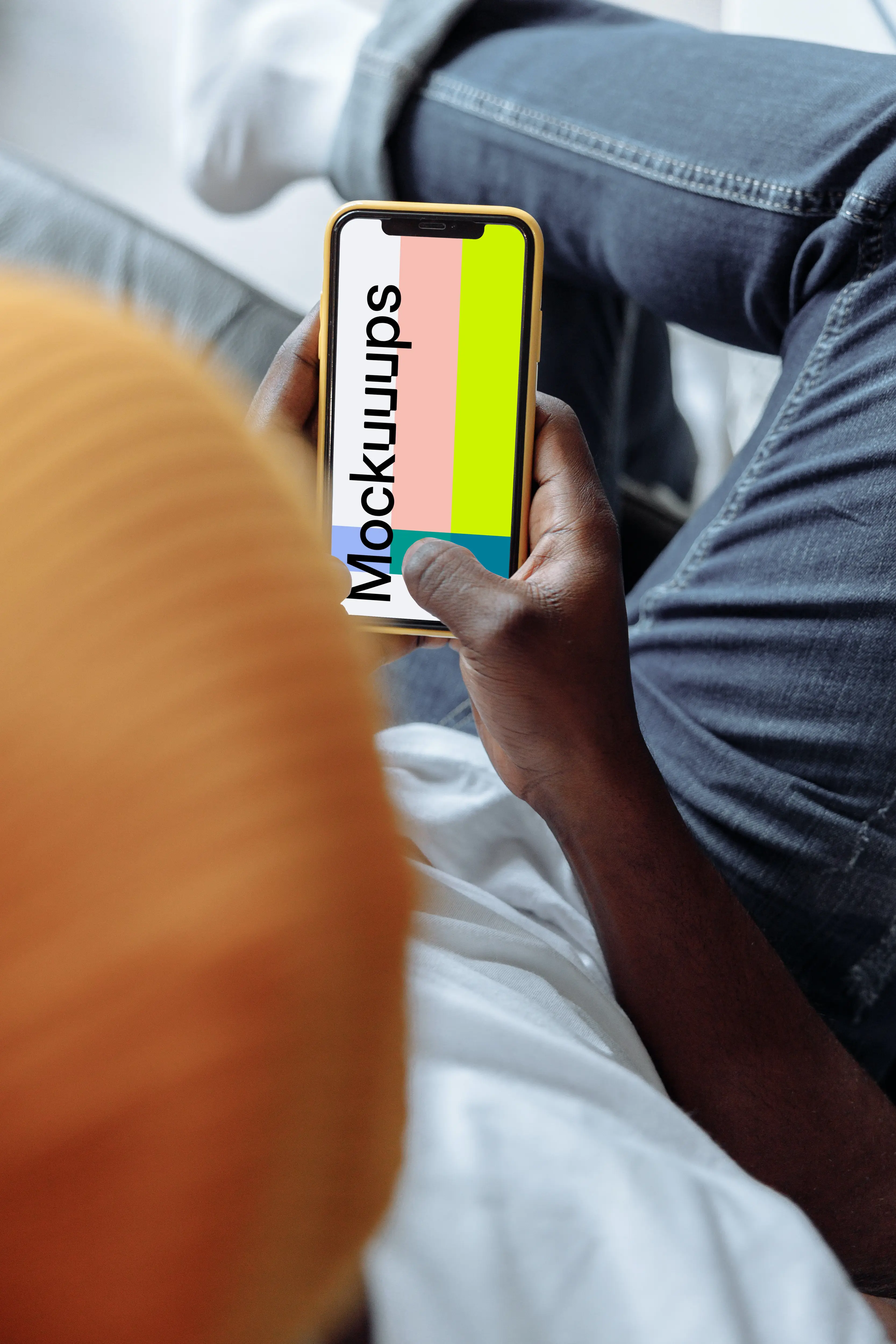 Hand holding iPhone mockup