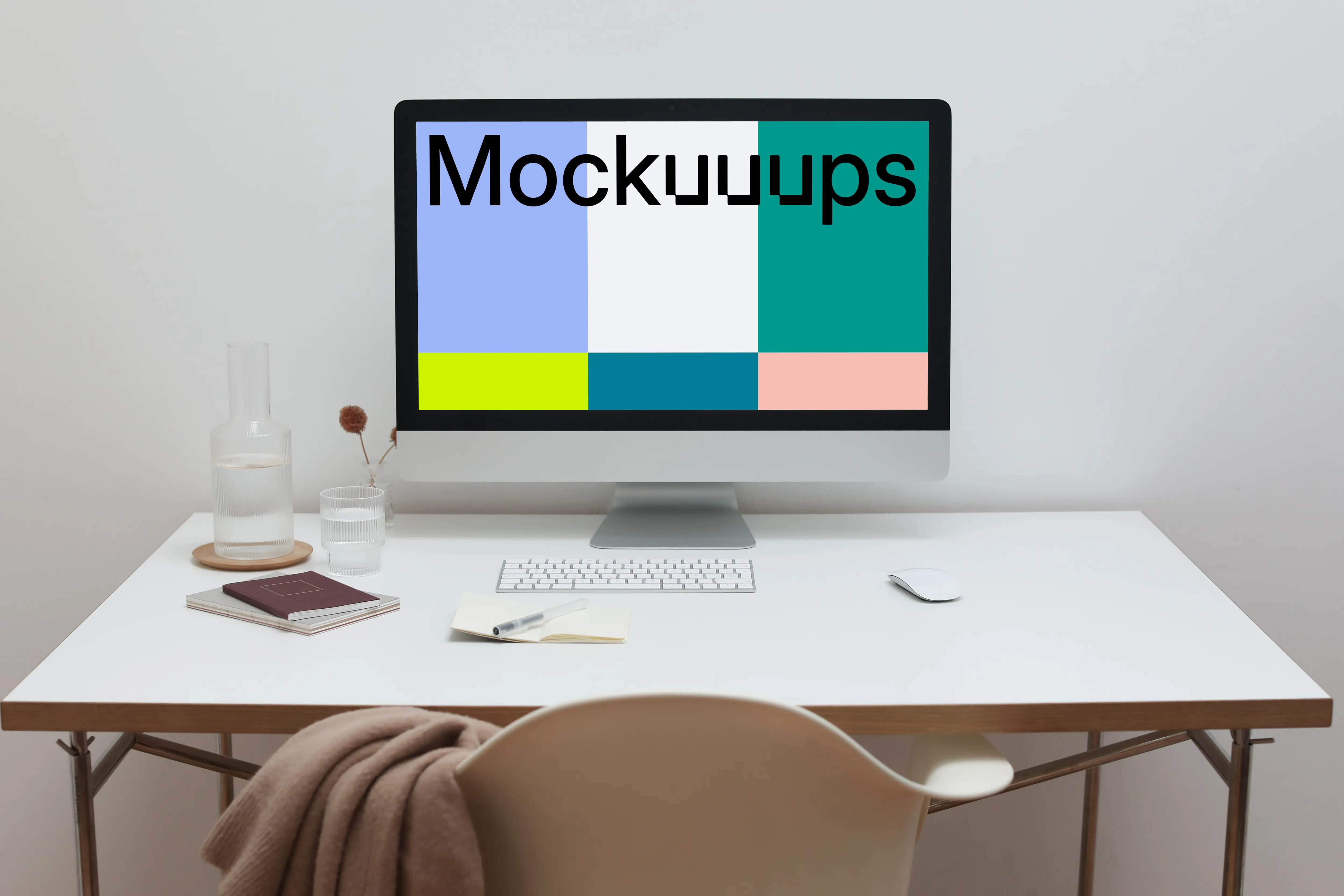 iMac mockup on a table with a jacket hanging on a chair in front of it