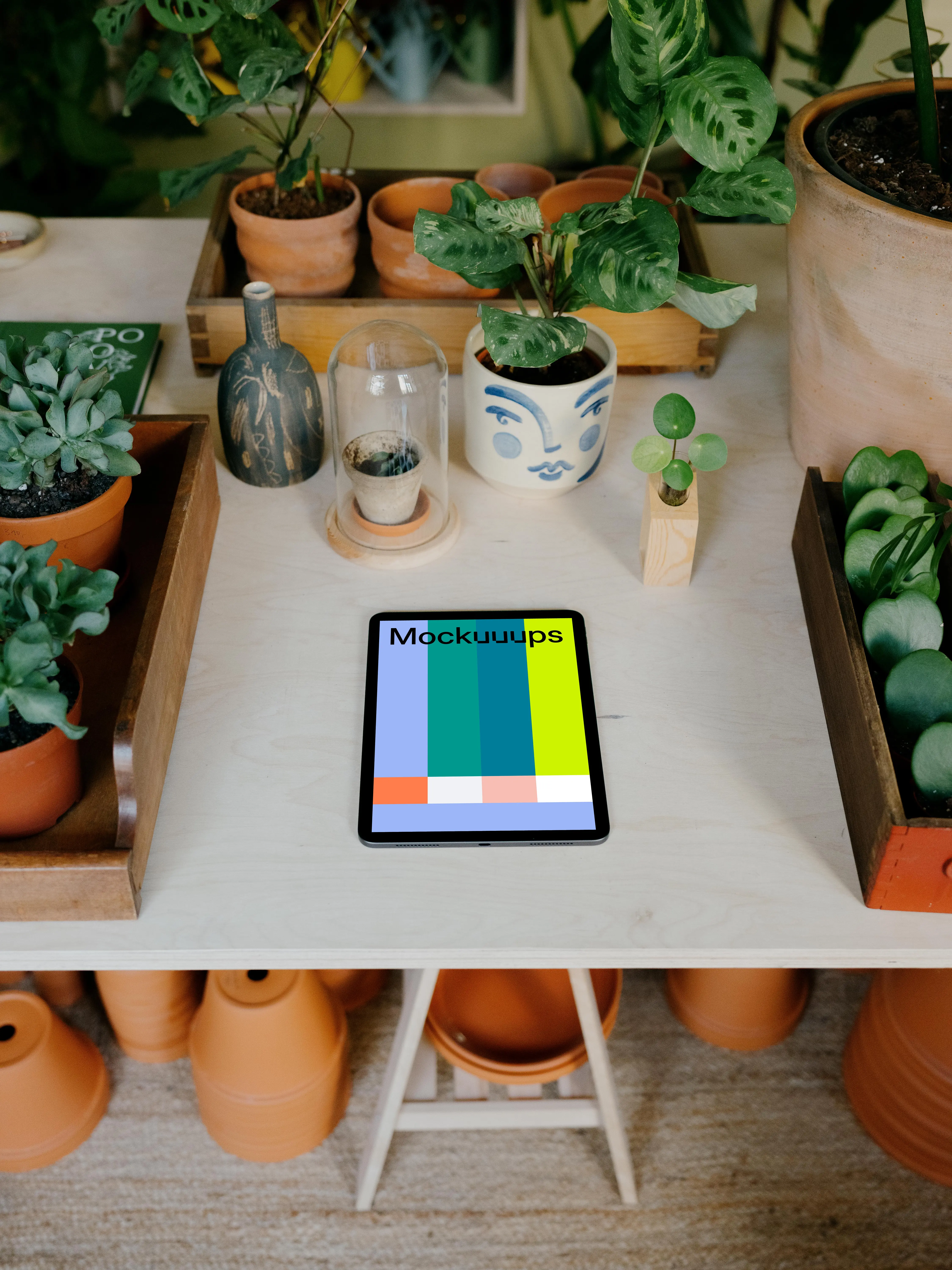 iPad mockup on a white garden table