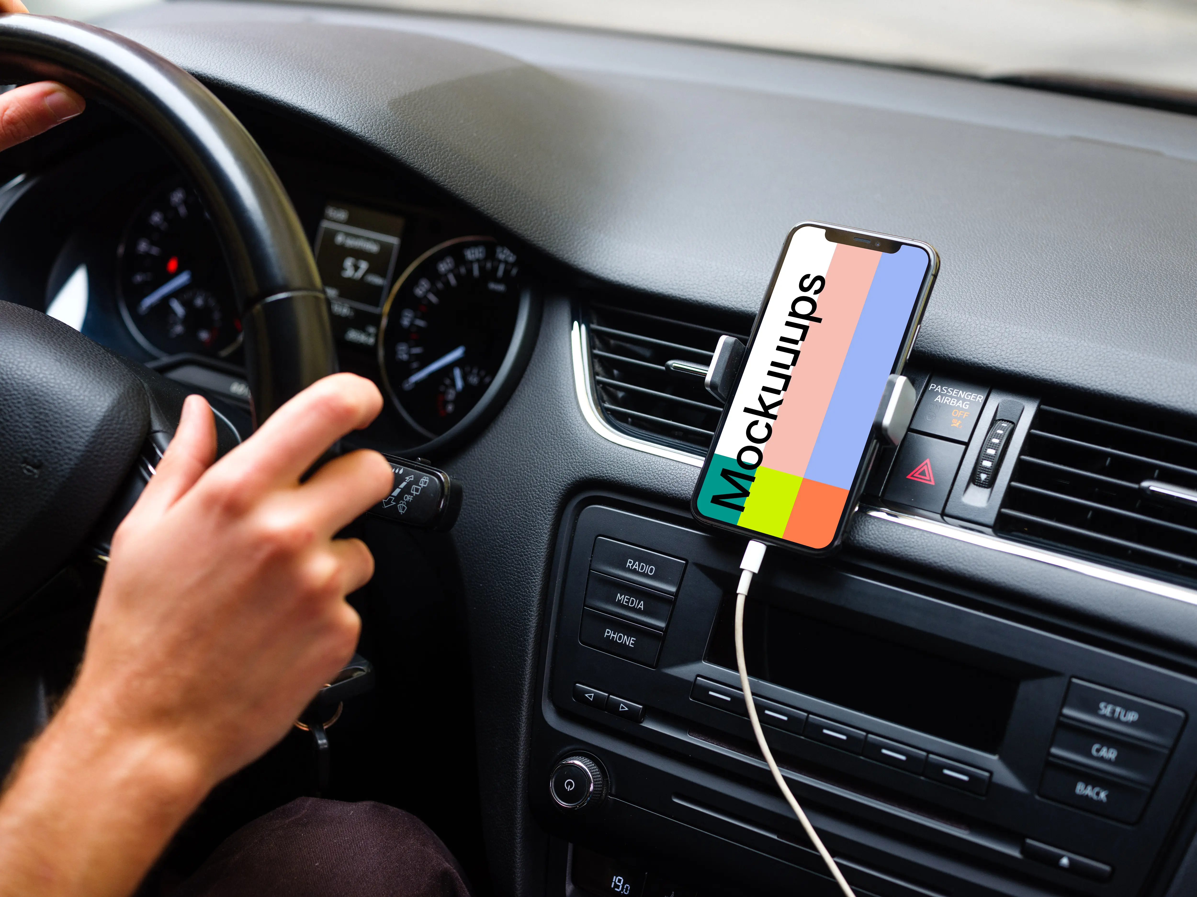 iPhone 11 mockup mounted next to car driver for navigation