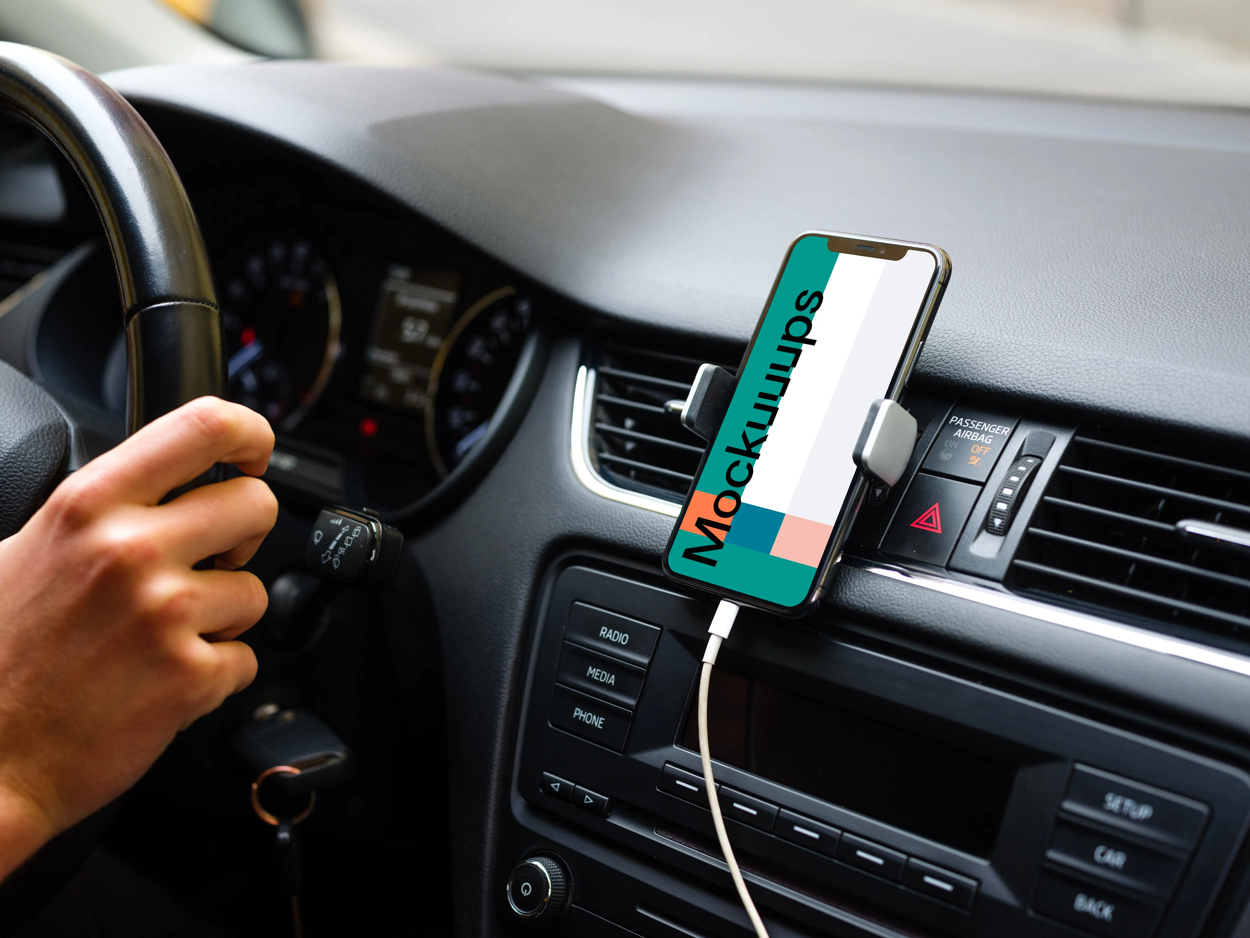 iPhone 11 mockup mounted on car dashboard with driver