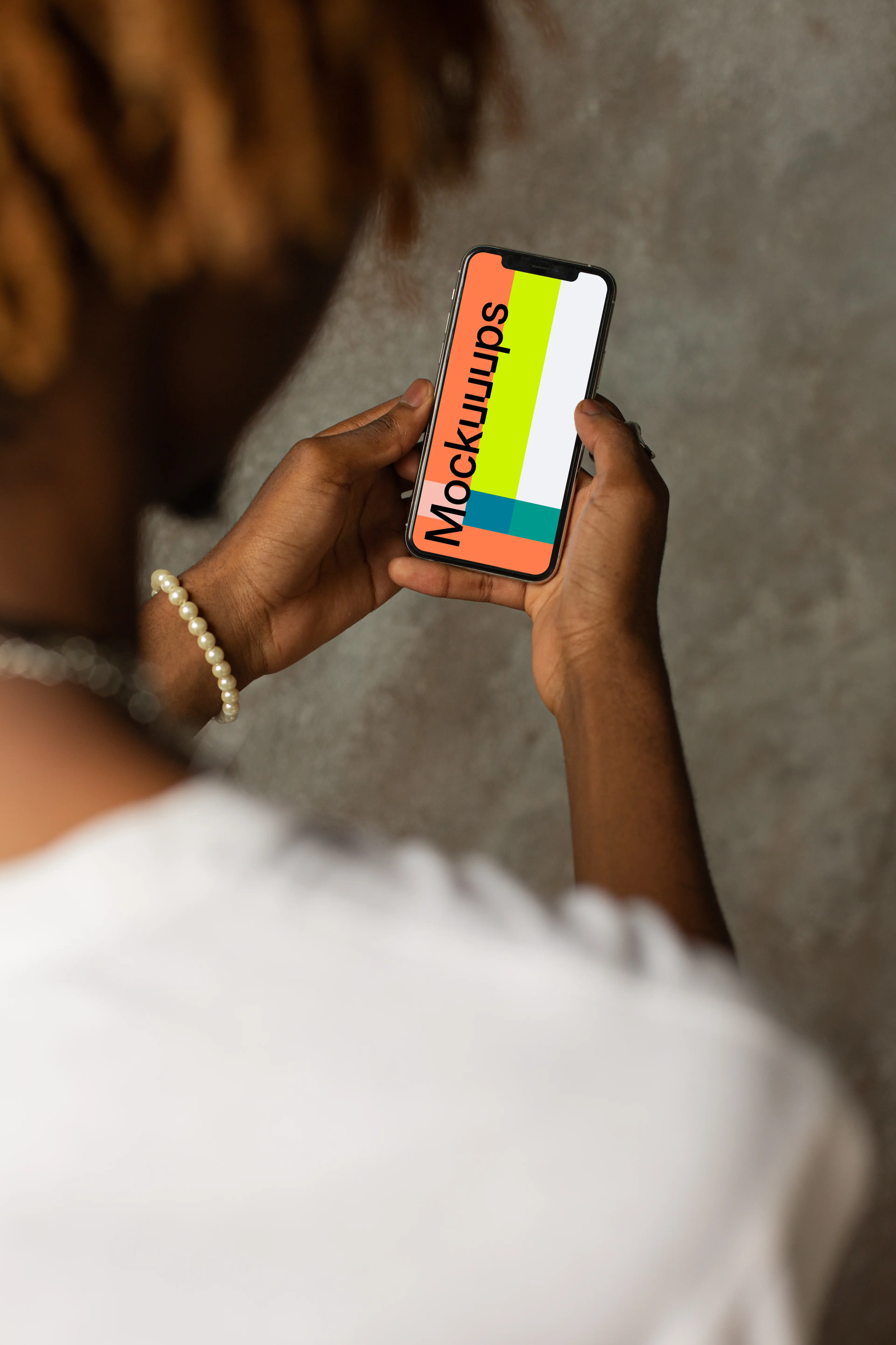 iPhone 12 Pro mockup held by user with both hands