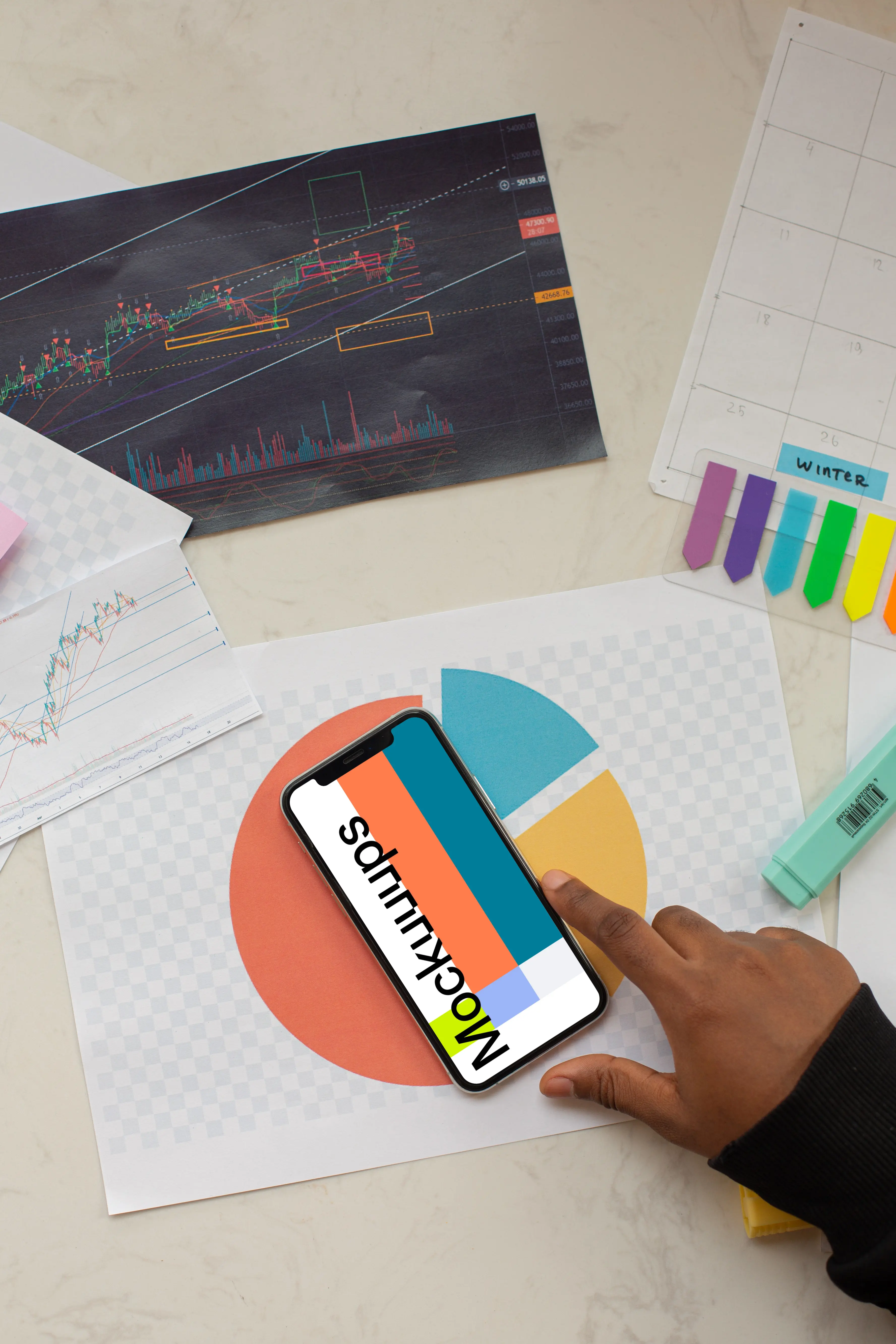 iPhone 12 Pro mockup placed on financial charts