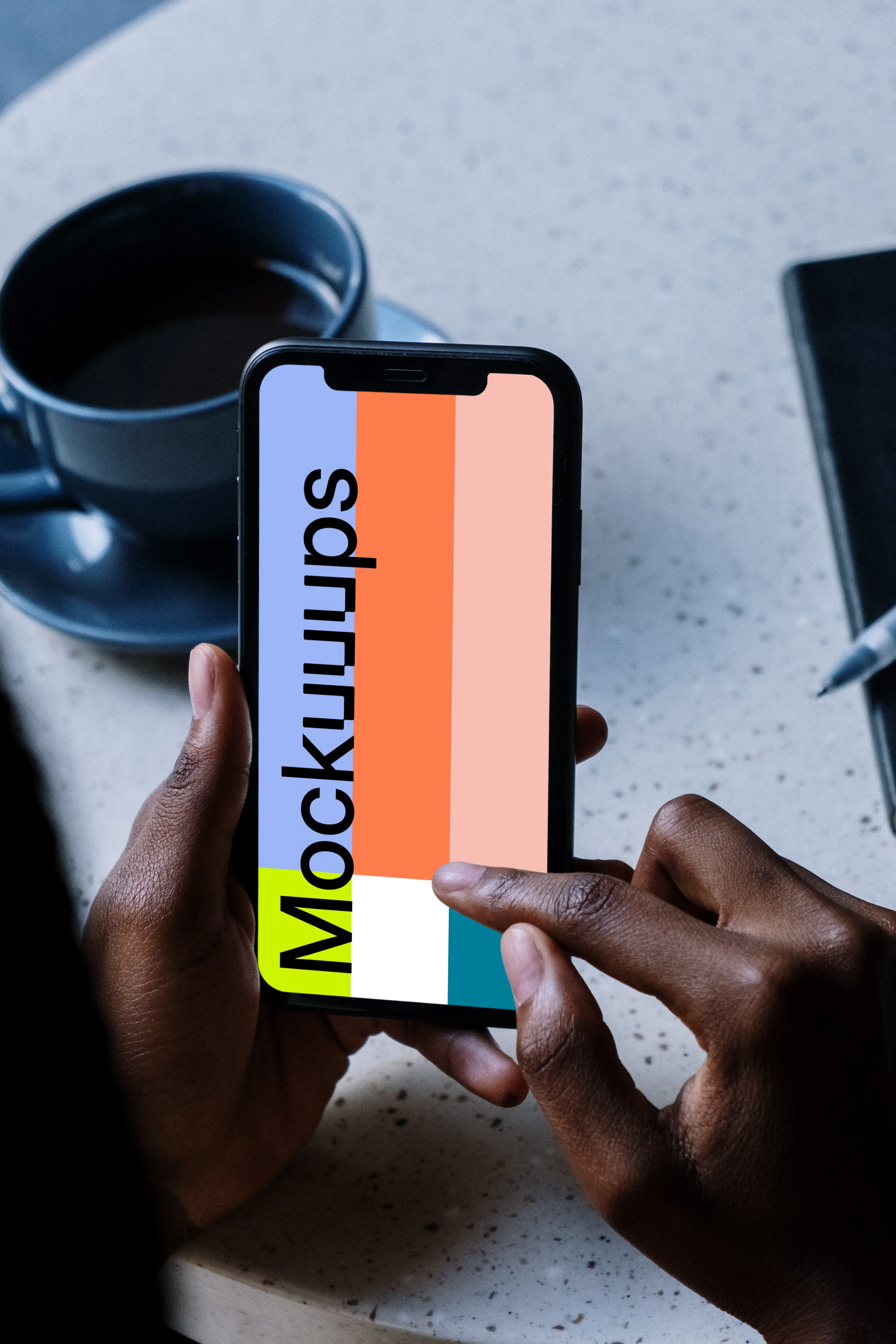 iPhone mockup beside a cup of coffee