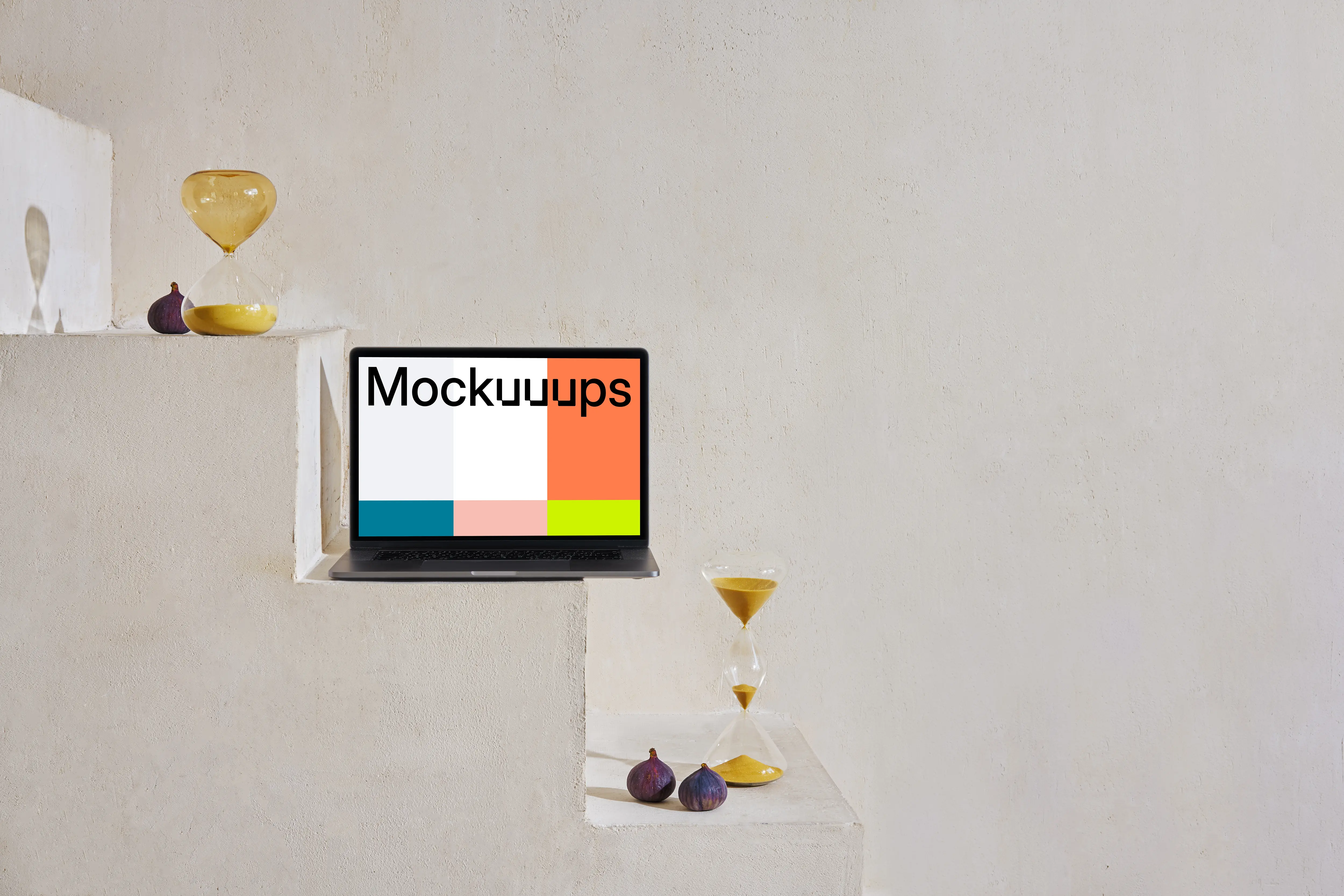 MacBook mockup on a staircase with hourglasses and onions at the side