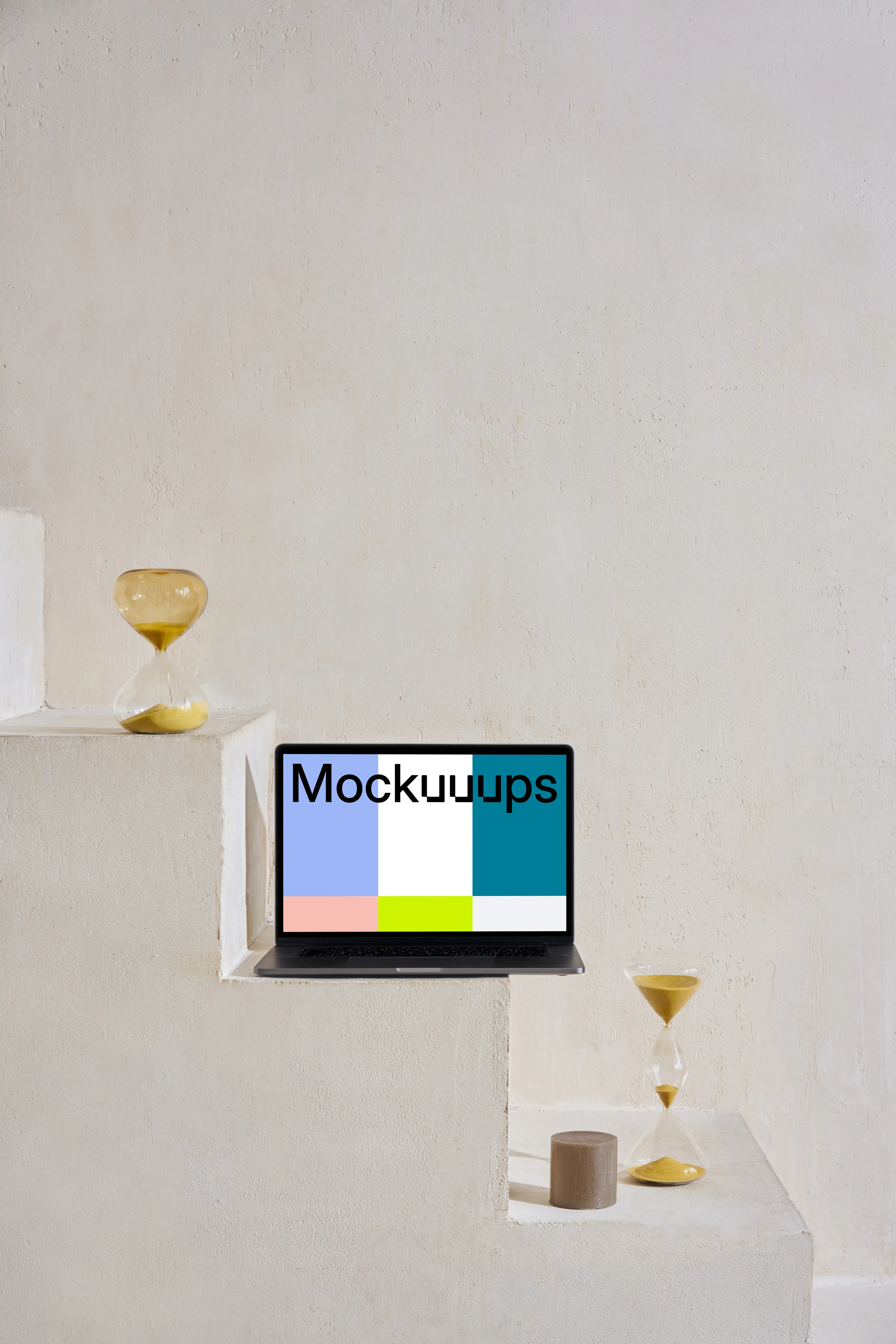 MacBook mockup on staircase with hourglass at the side