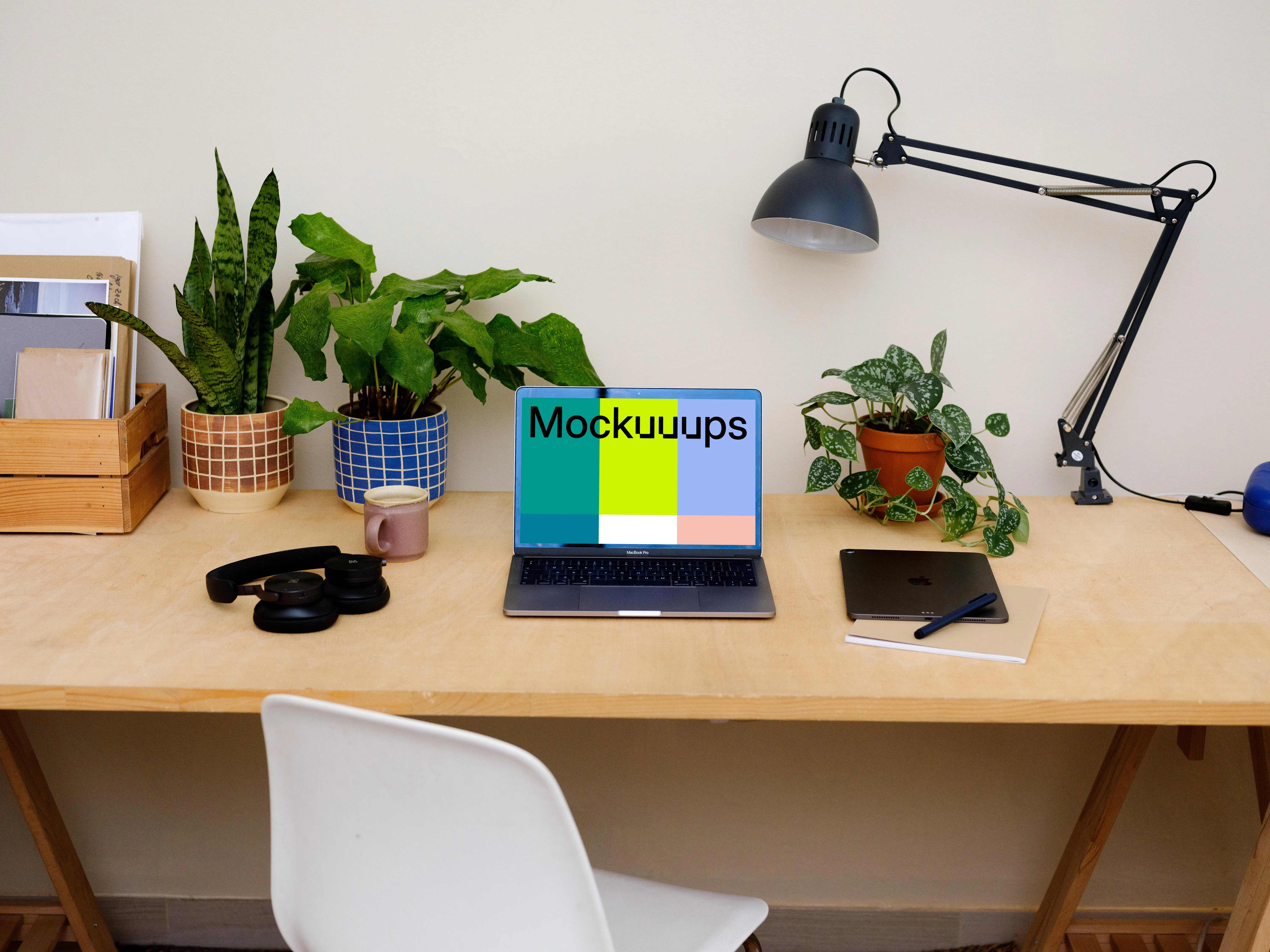  MacBook Pro mockup on a light brown table.