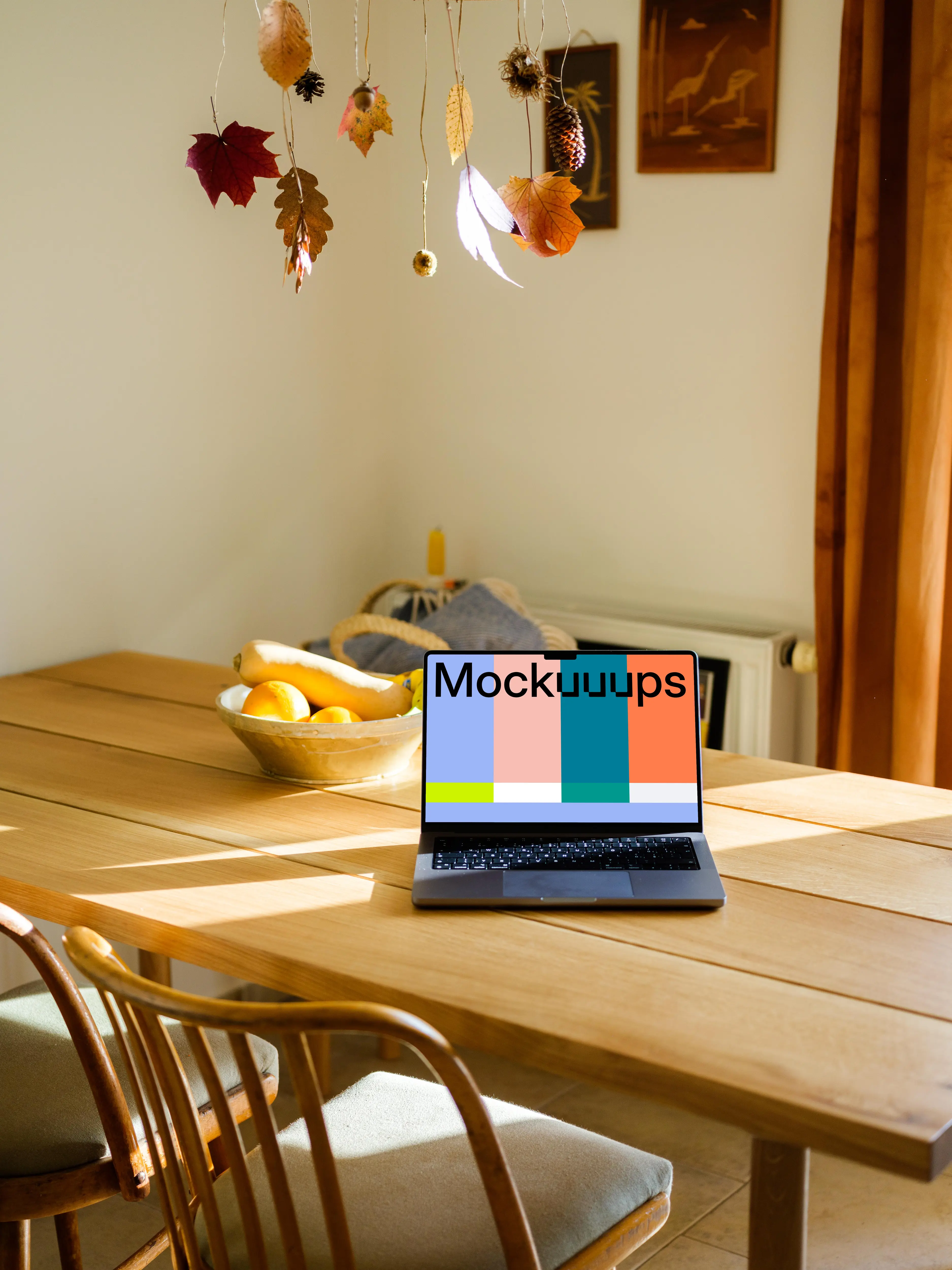 MacBook Pro mockup on a table in front of a fruit basket 