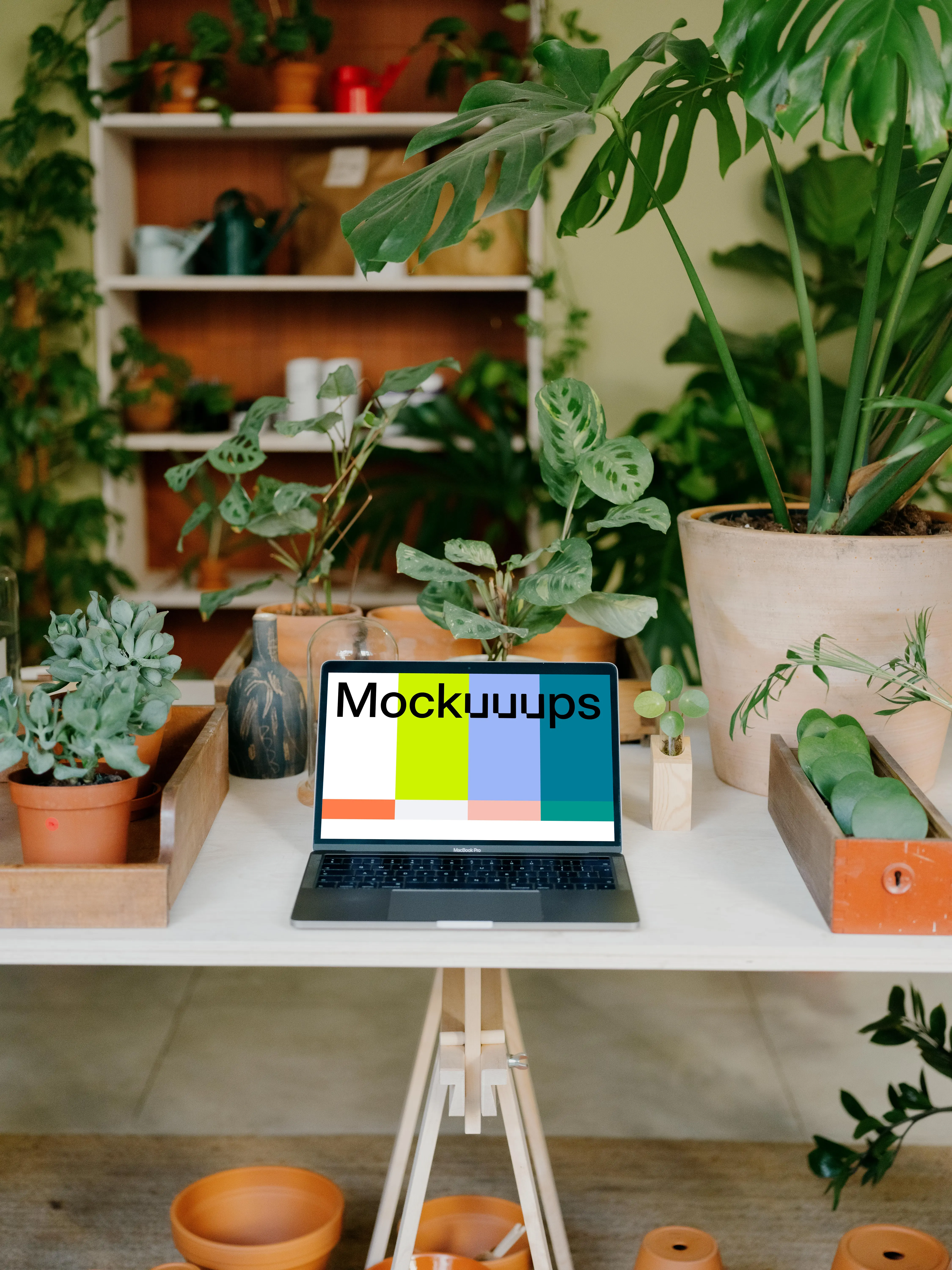 MacBook Pro Mockup on a white garden table.