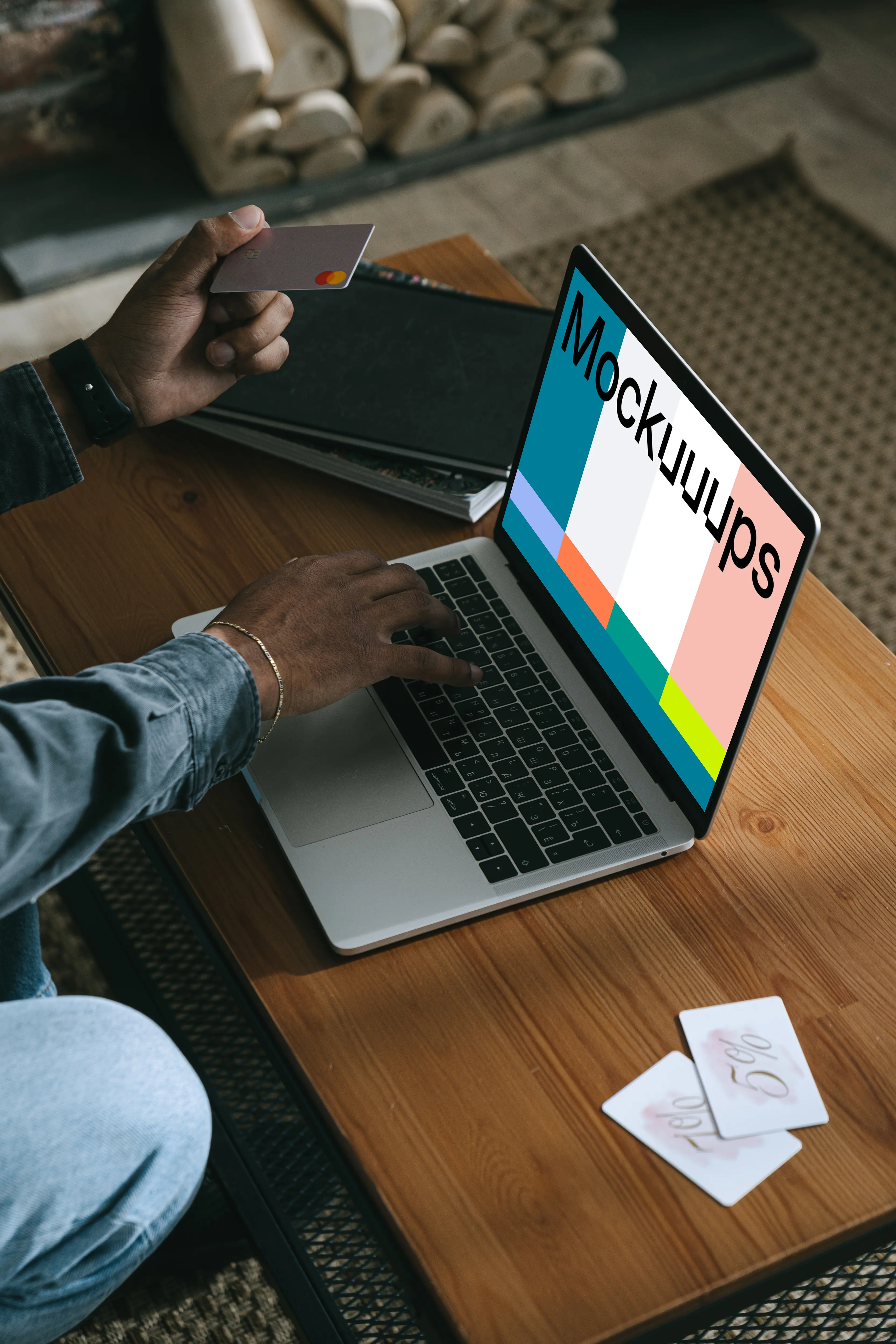 Man entering credit card details on a MacBook Pro mockup