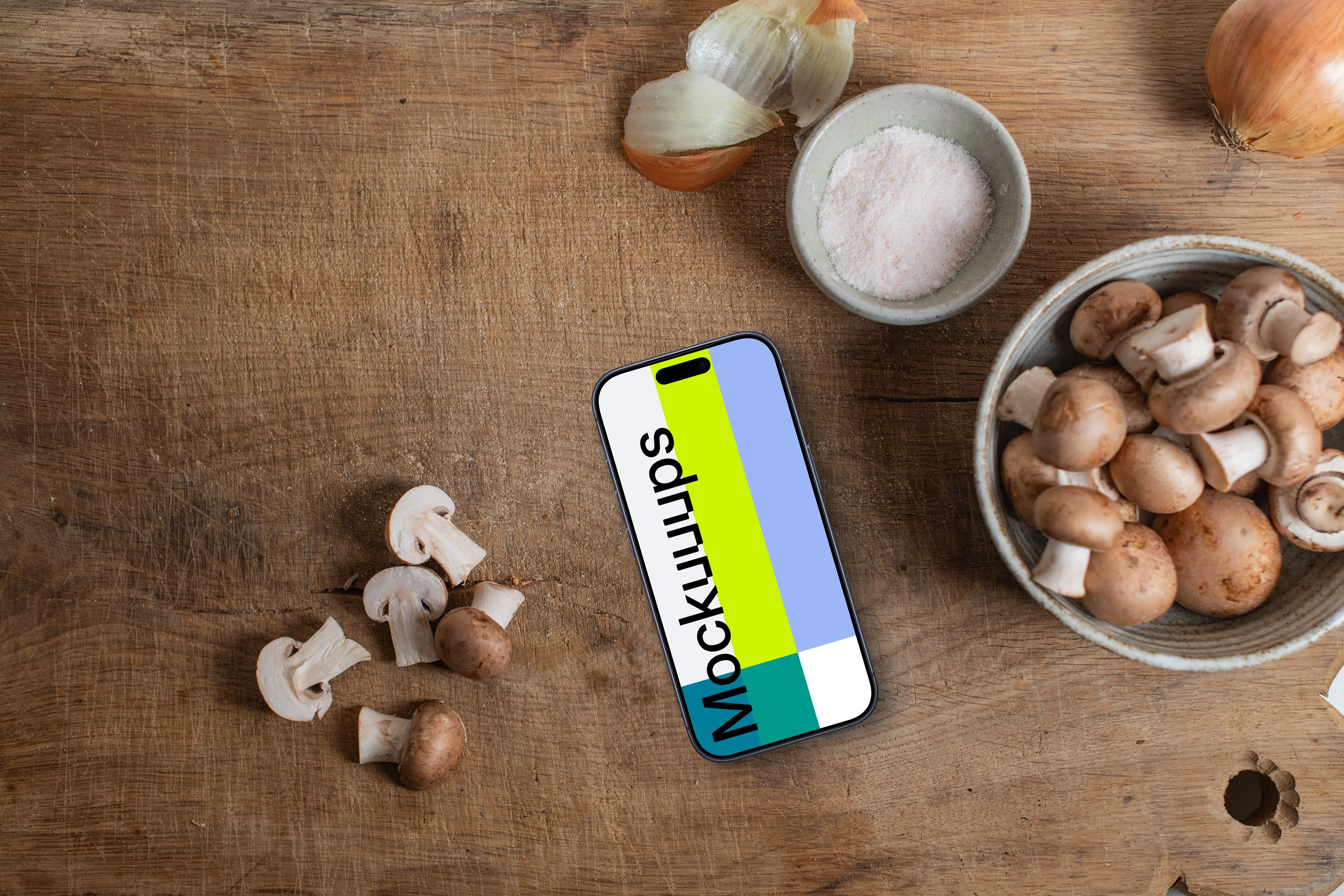 Mushrooms with a iPhone mockup on sideboard