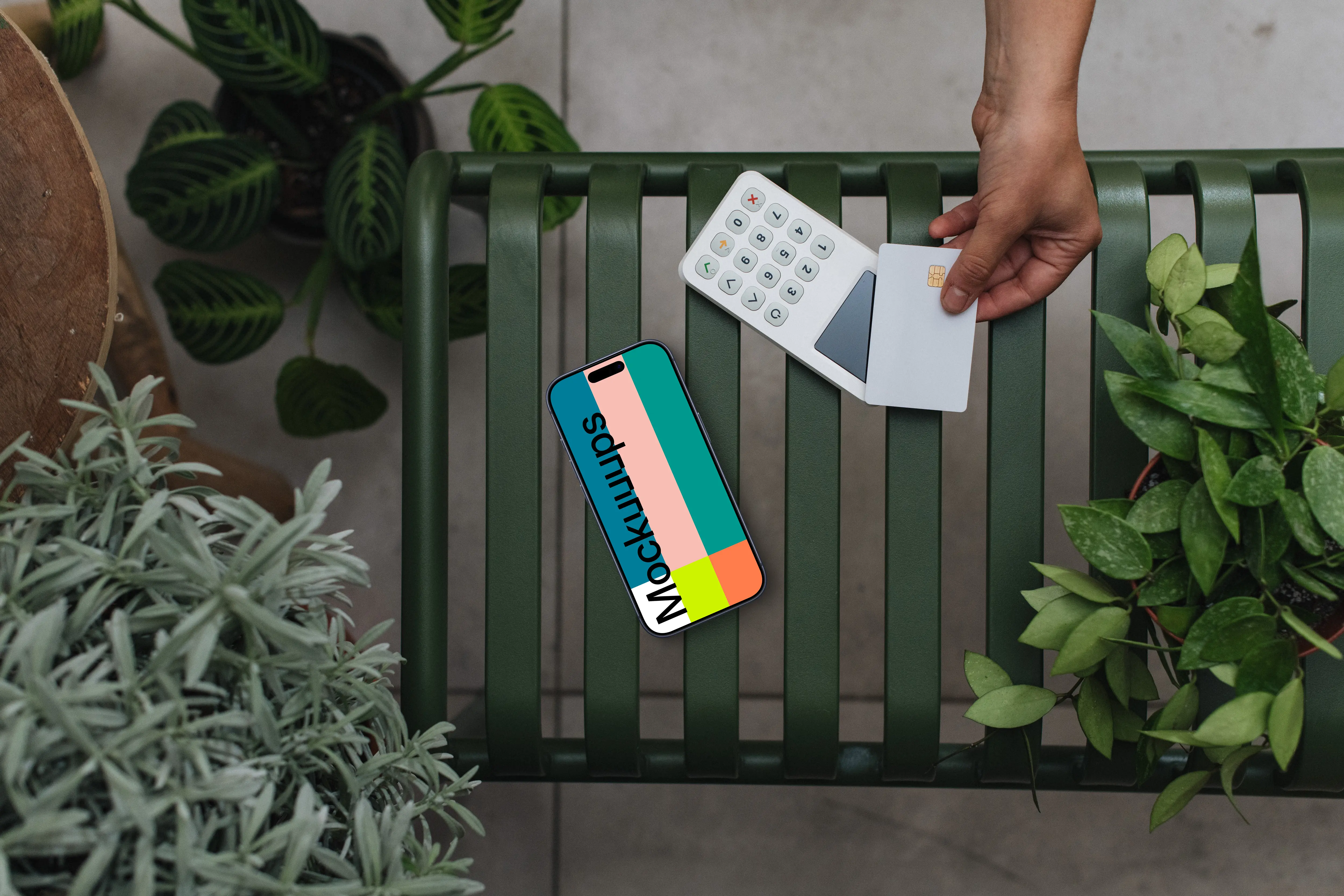 Natural oasis of plants with payment terminal and an iPhone mockup