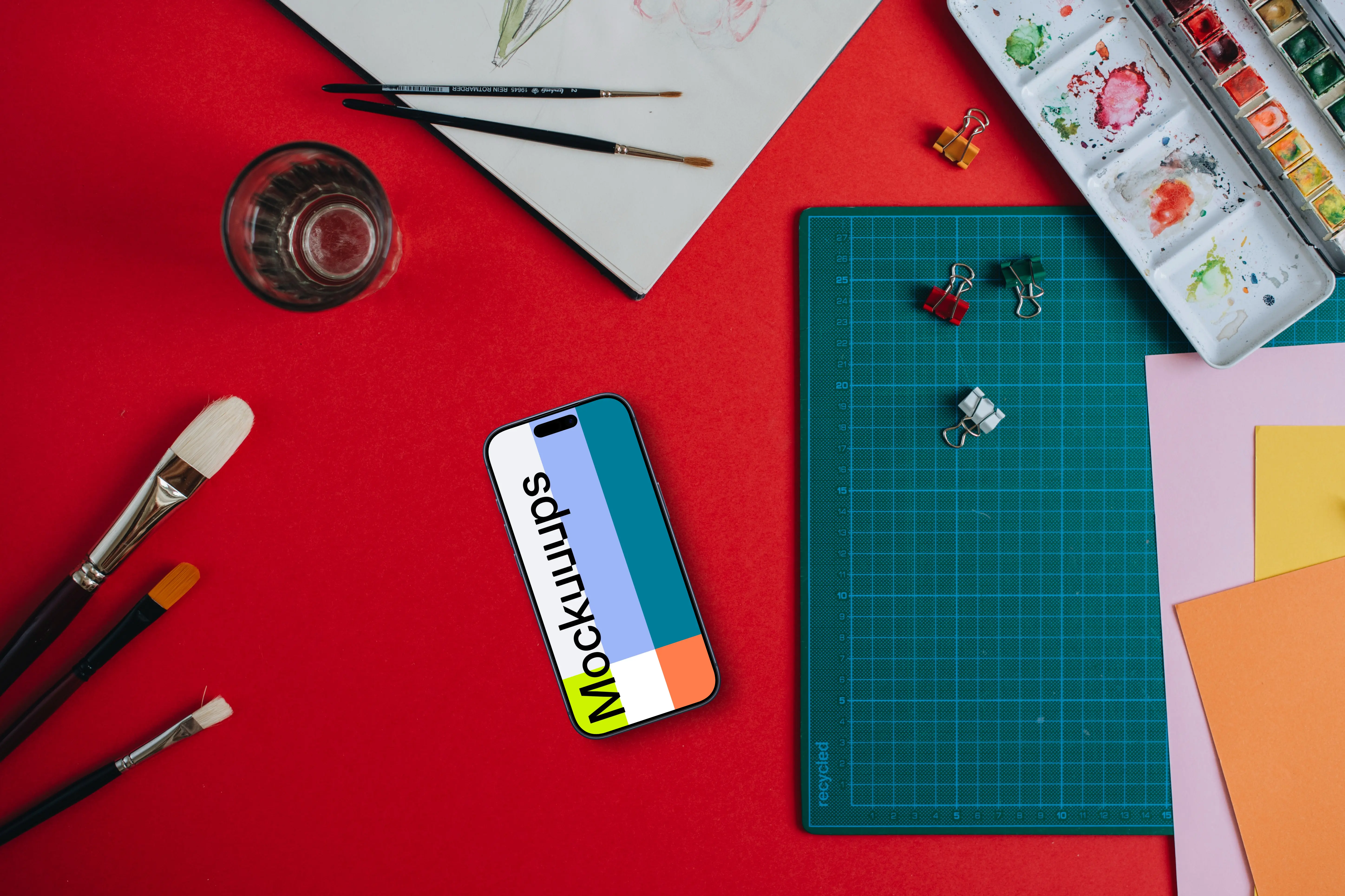 Phone mockup with painting accessories around