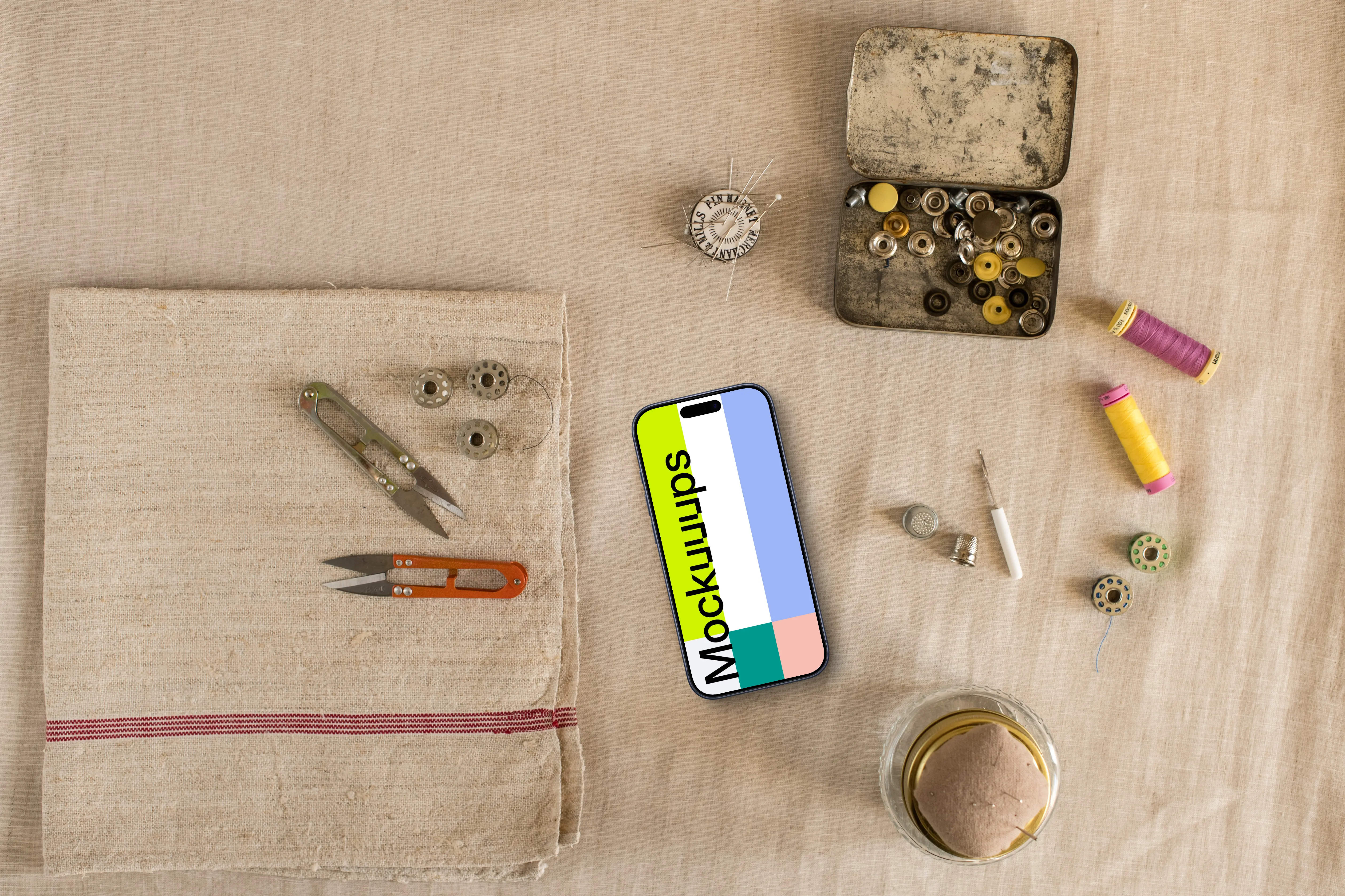 Phone mockup with sewing accessories