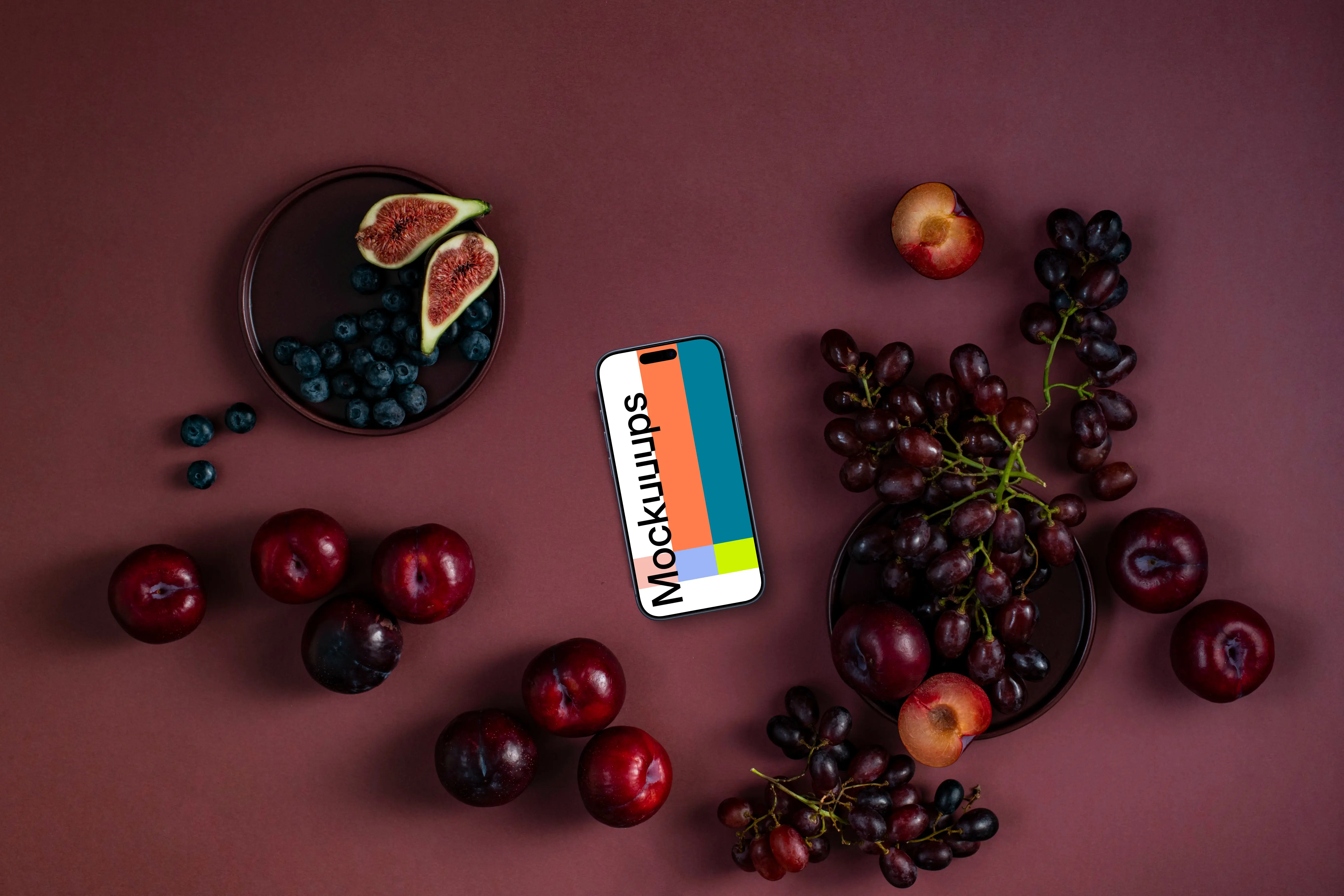 Phone with fruits on the Viva Magenta background