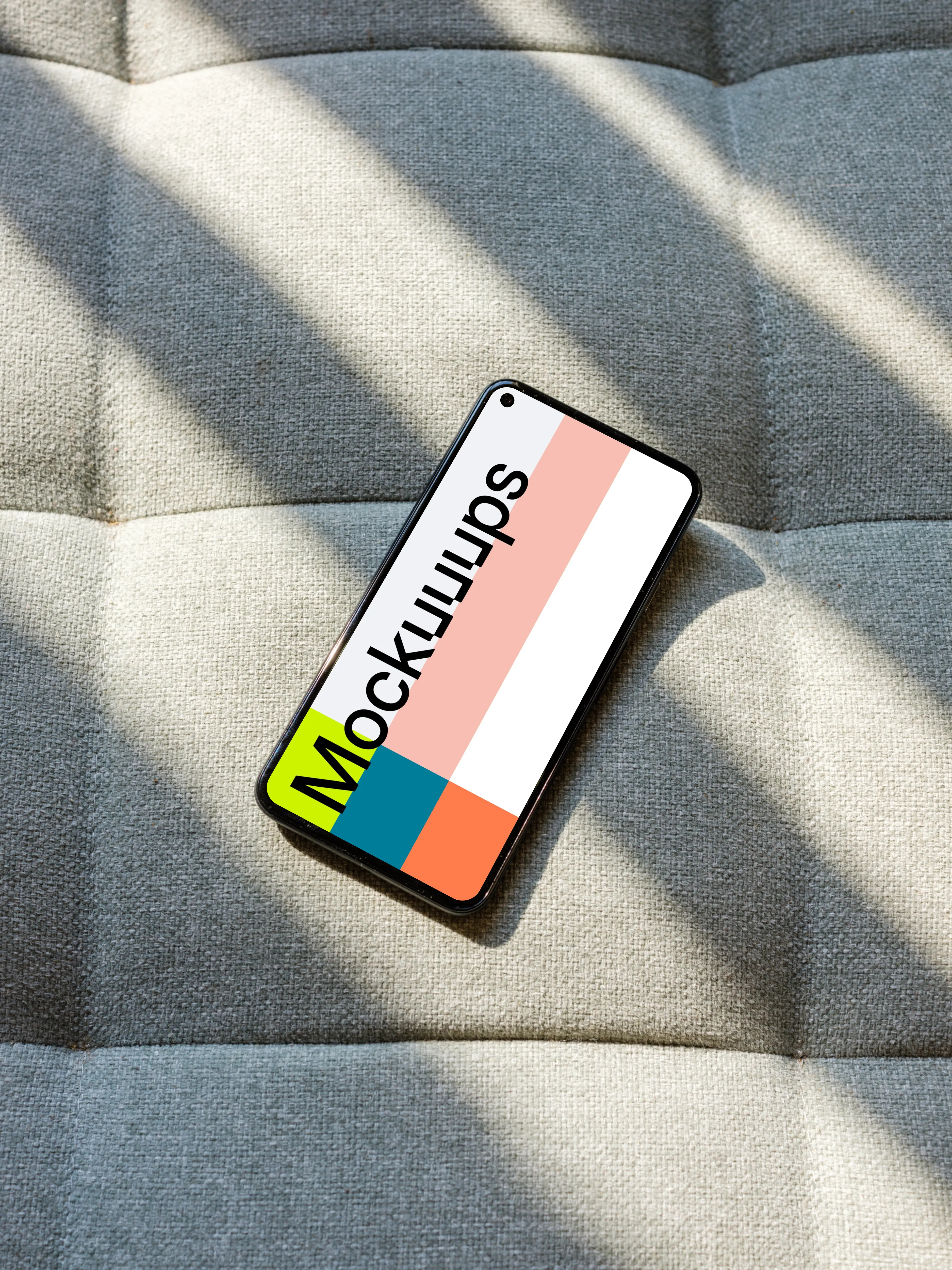 Pixel 5 mockup on a grey sofa