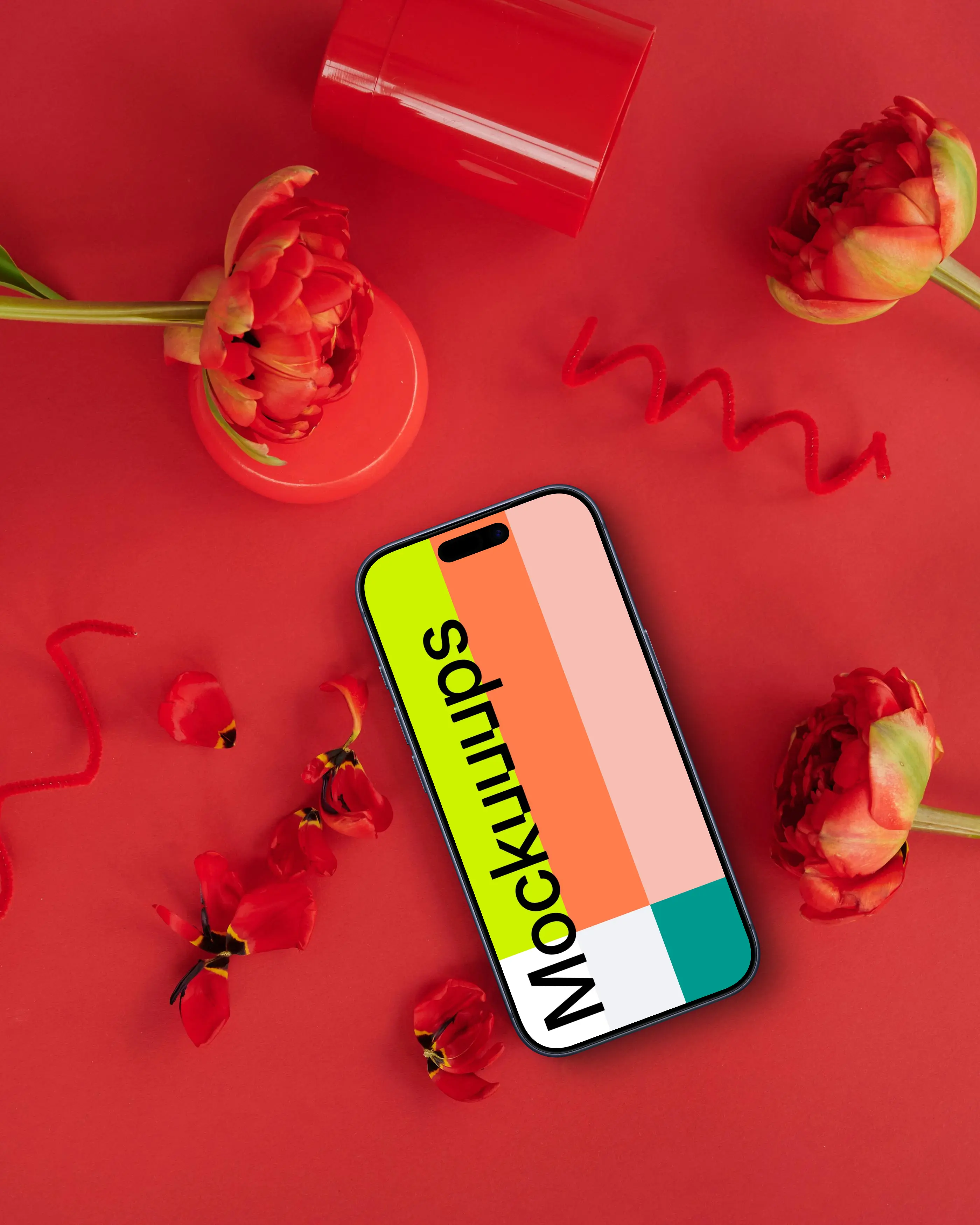 Smartphone mockup in a red scene with flowers