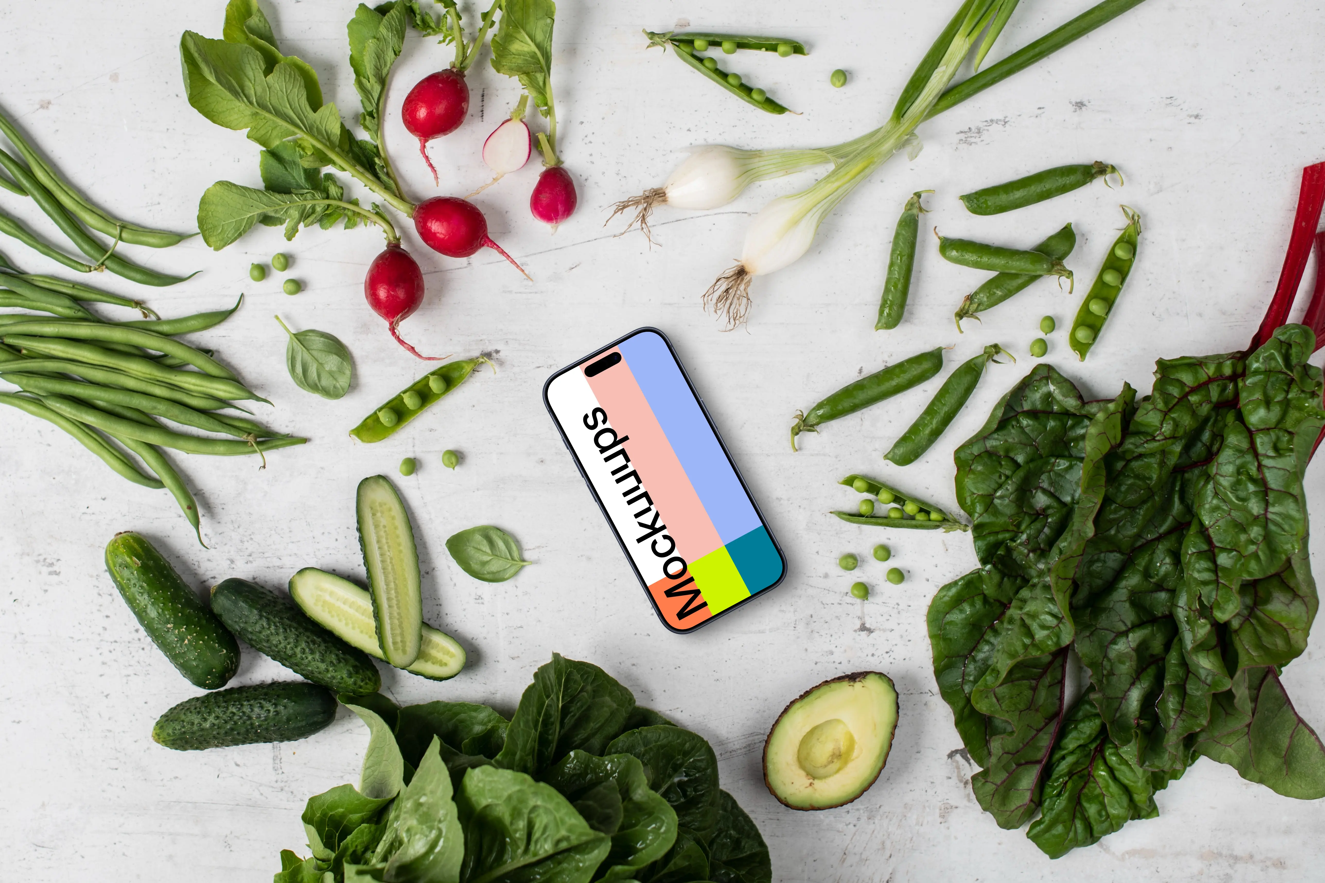 Smartphone mockup in the middle of vegetables