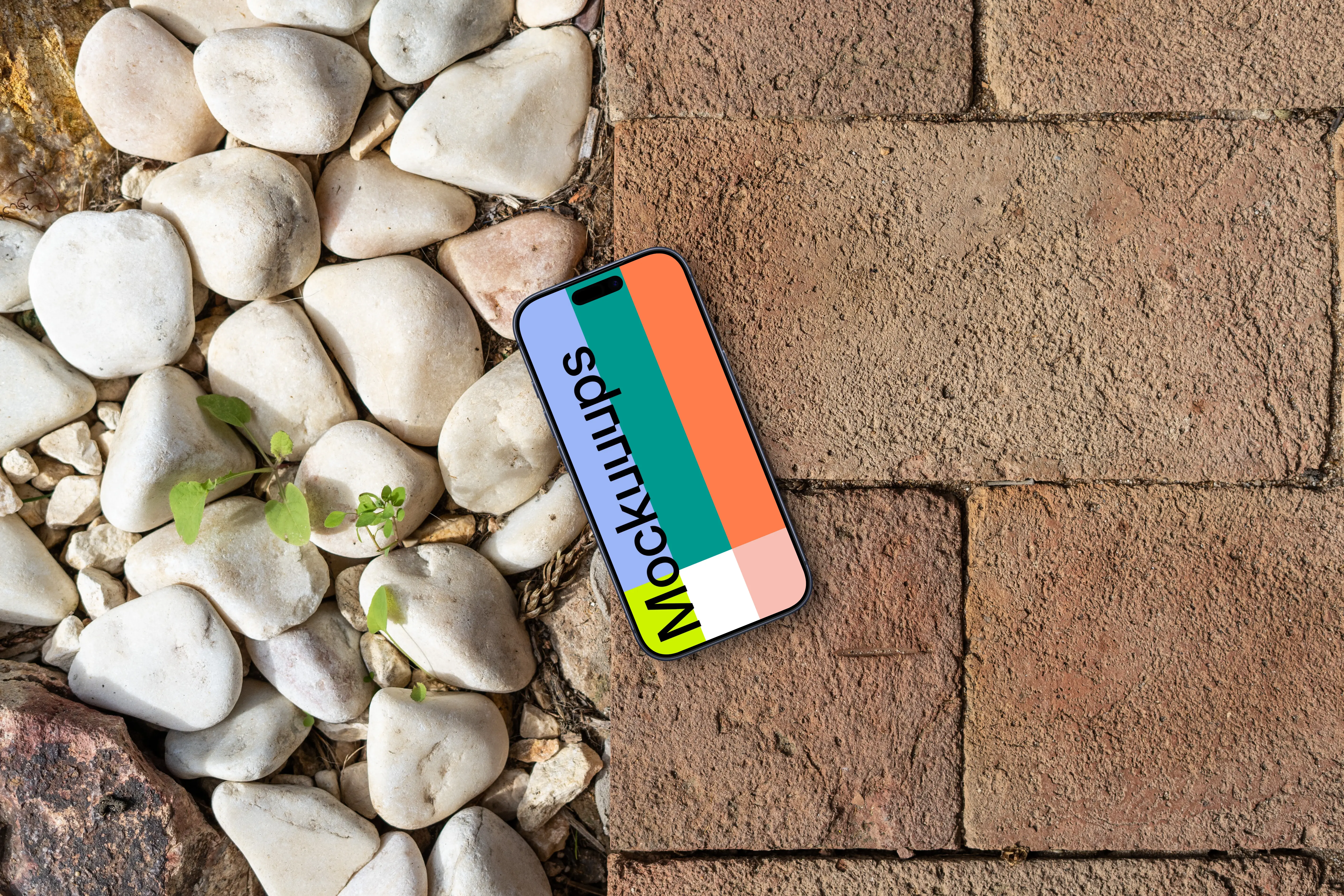 Smartphone mockup laying on a brick path