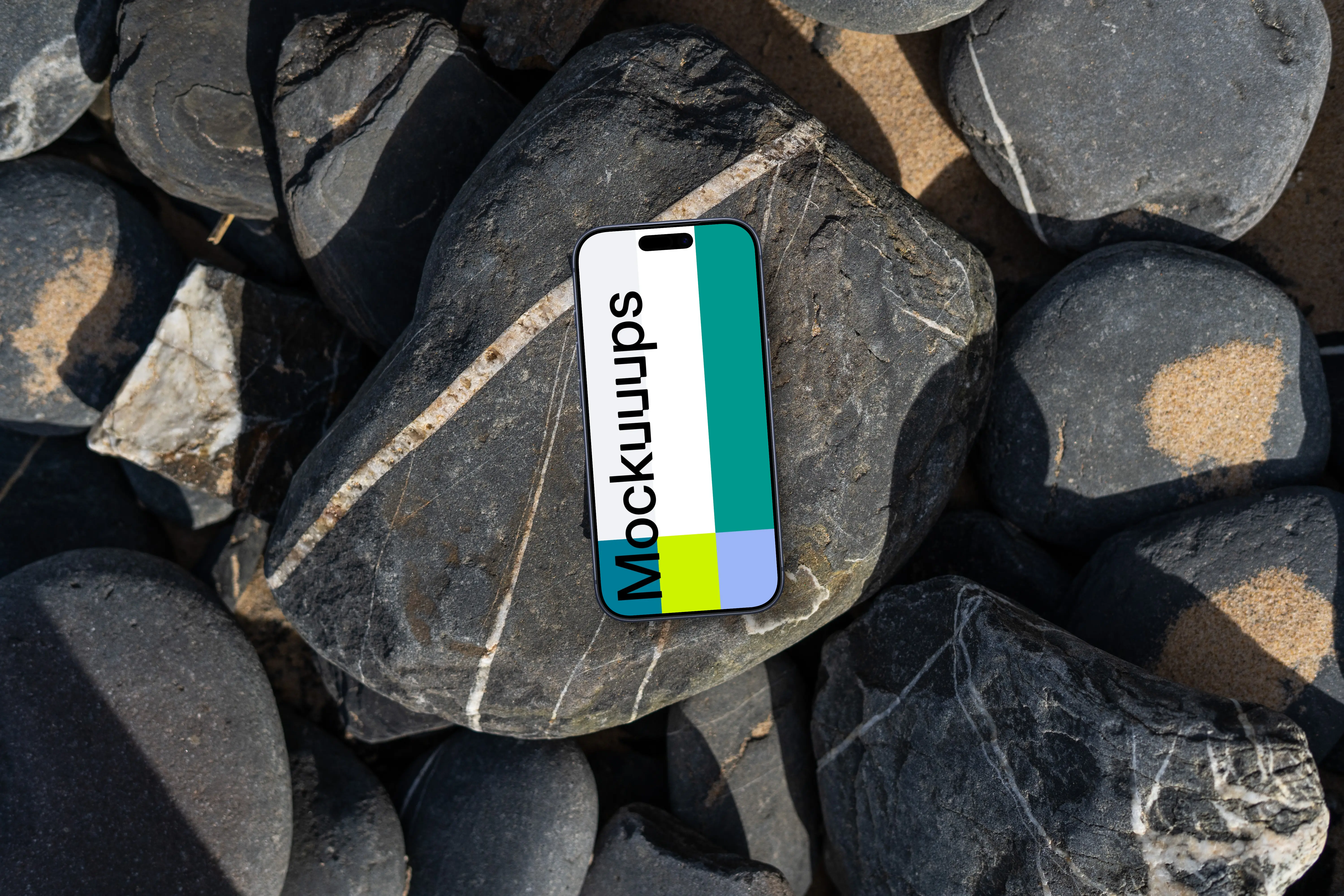 Smartphone mockup laying on a pile of rocks