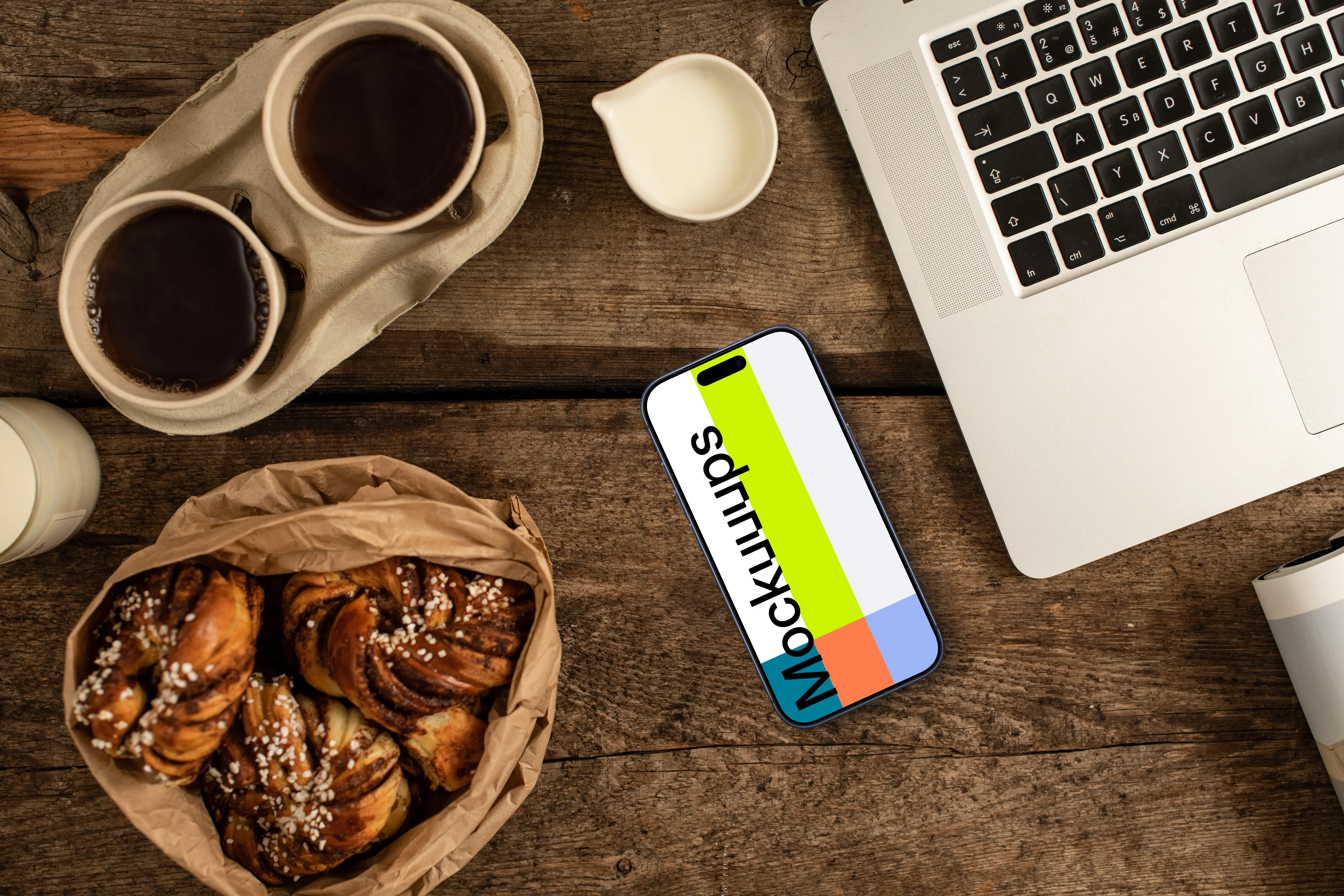 Smartphone mockup next to the coffee and pastries