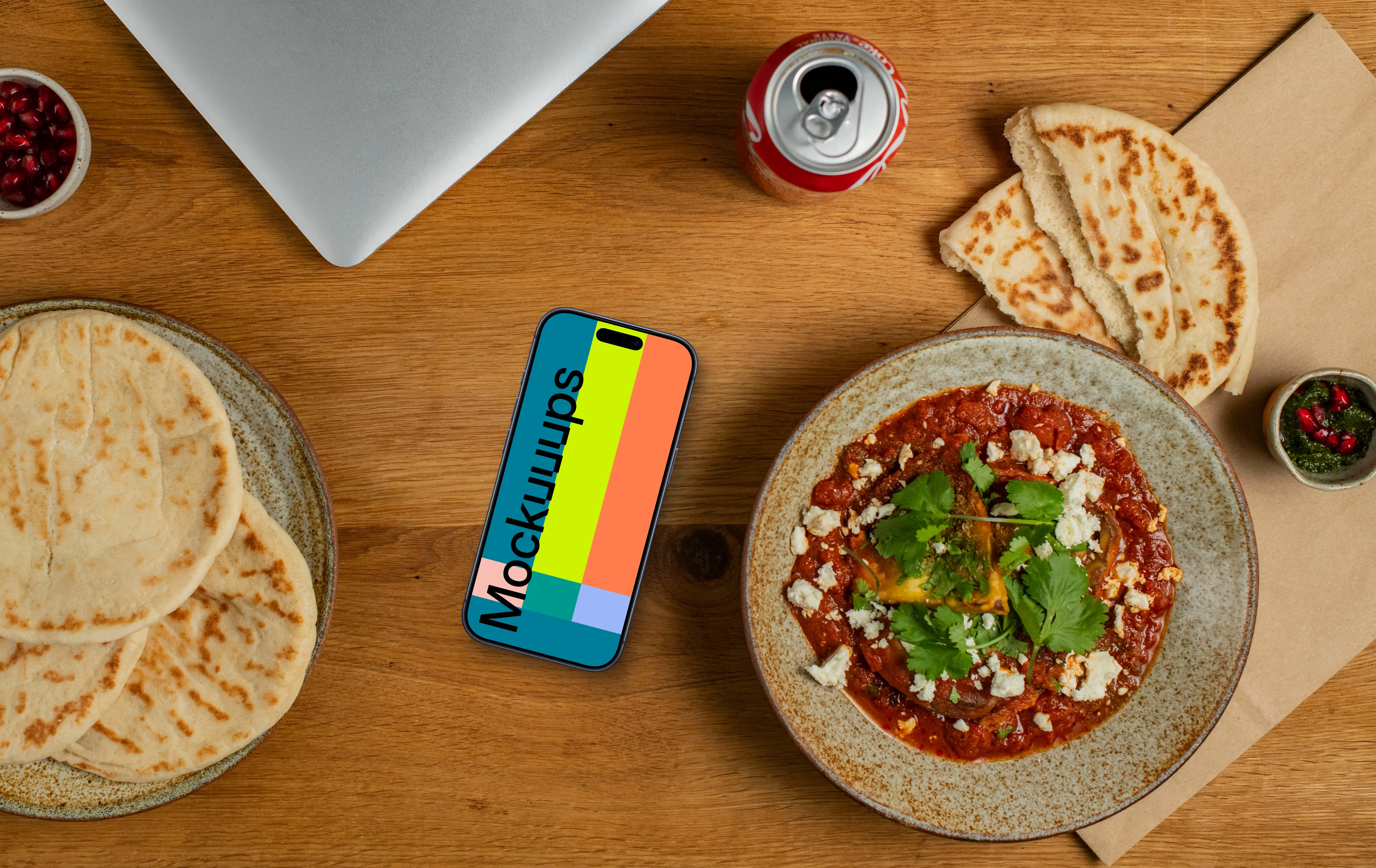 Smartphone mockup next to the Muhammara