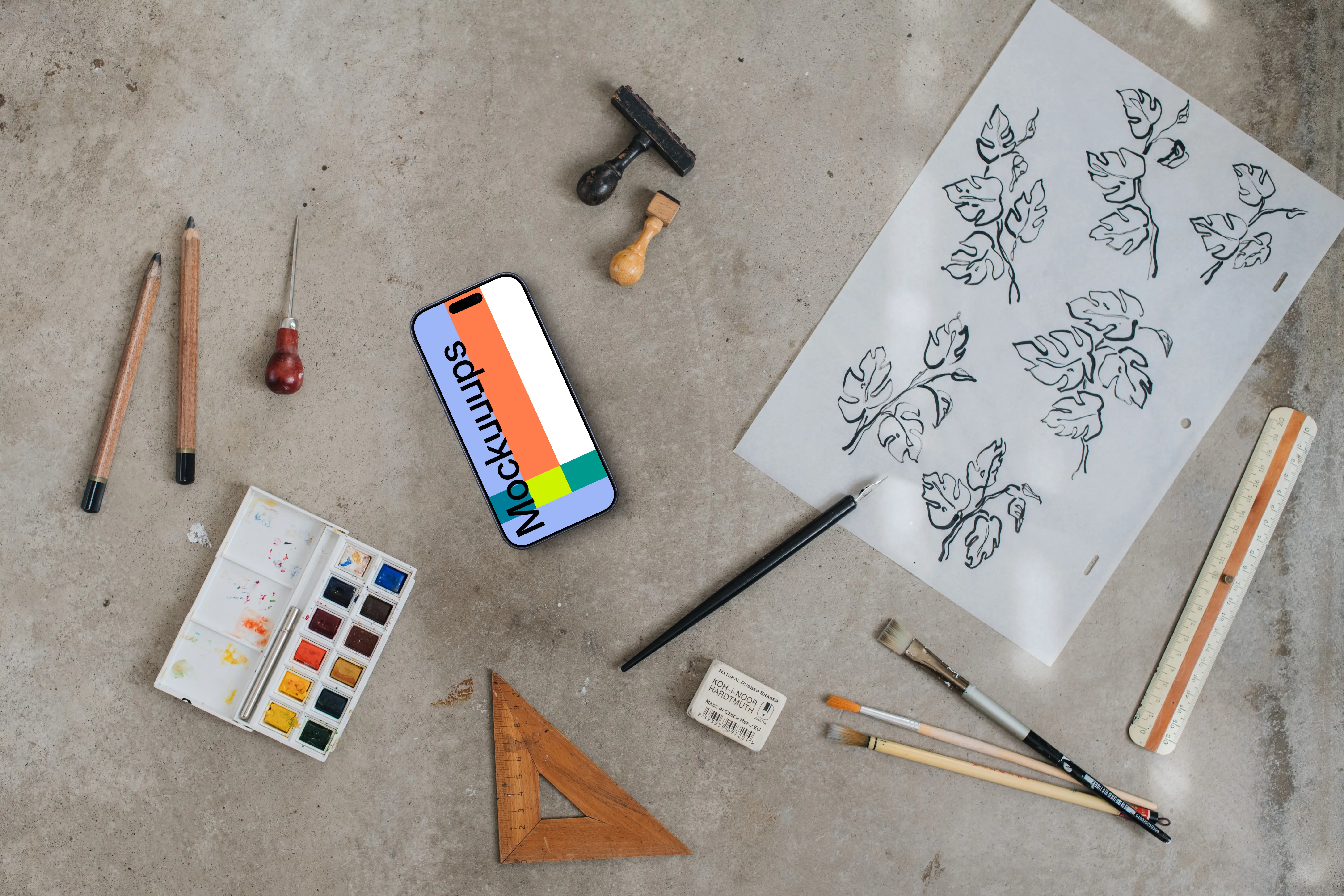 Smartphone mockup next to the painting accessories