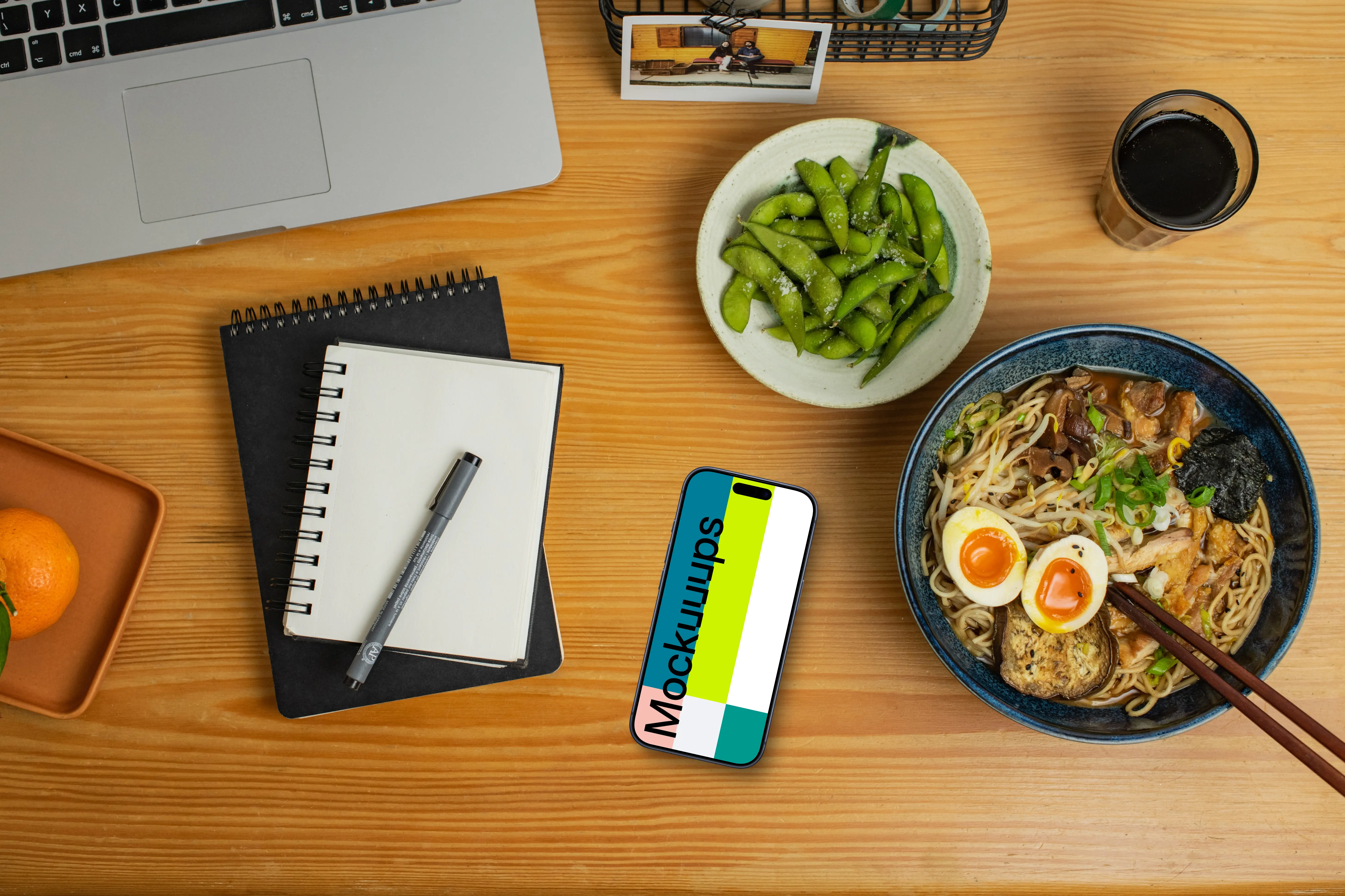 Smartphone mockup on a table with ramen