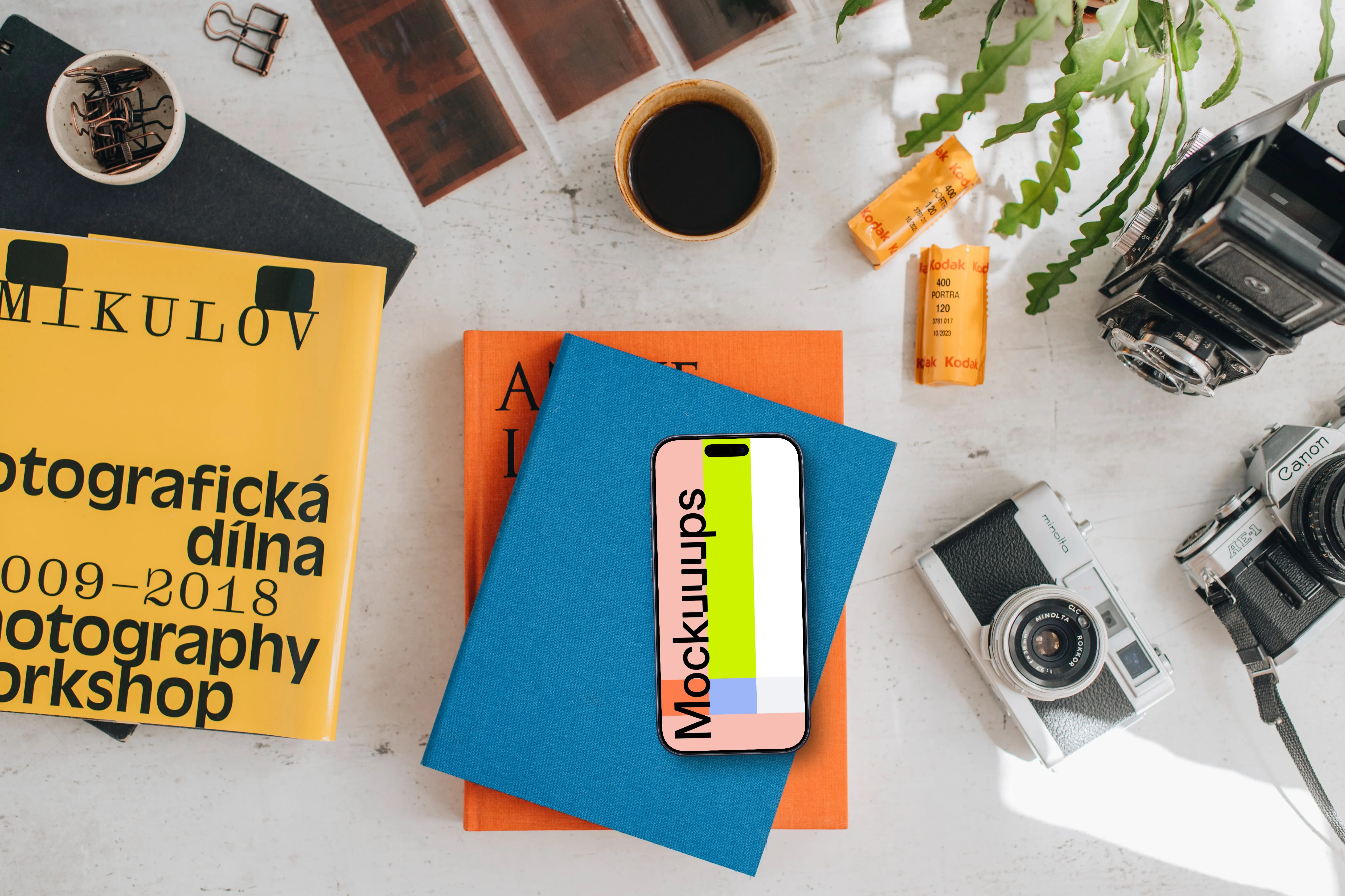 Smartphone mockup placed on colorful books