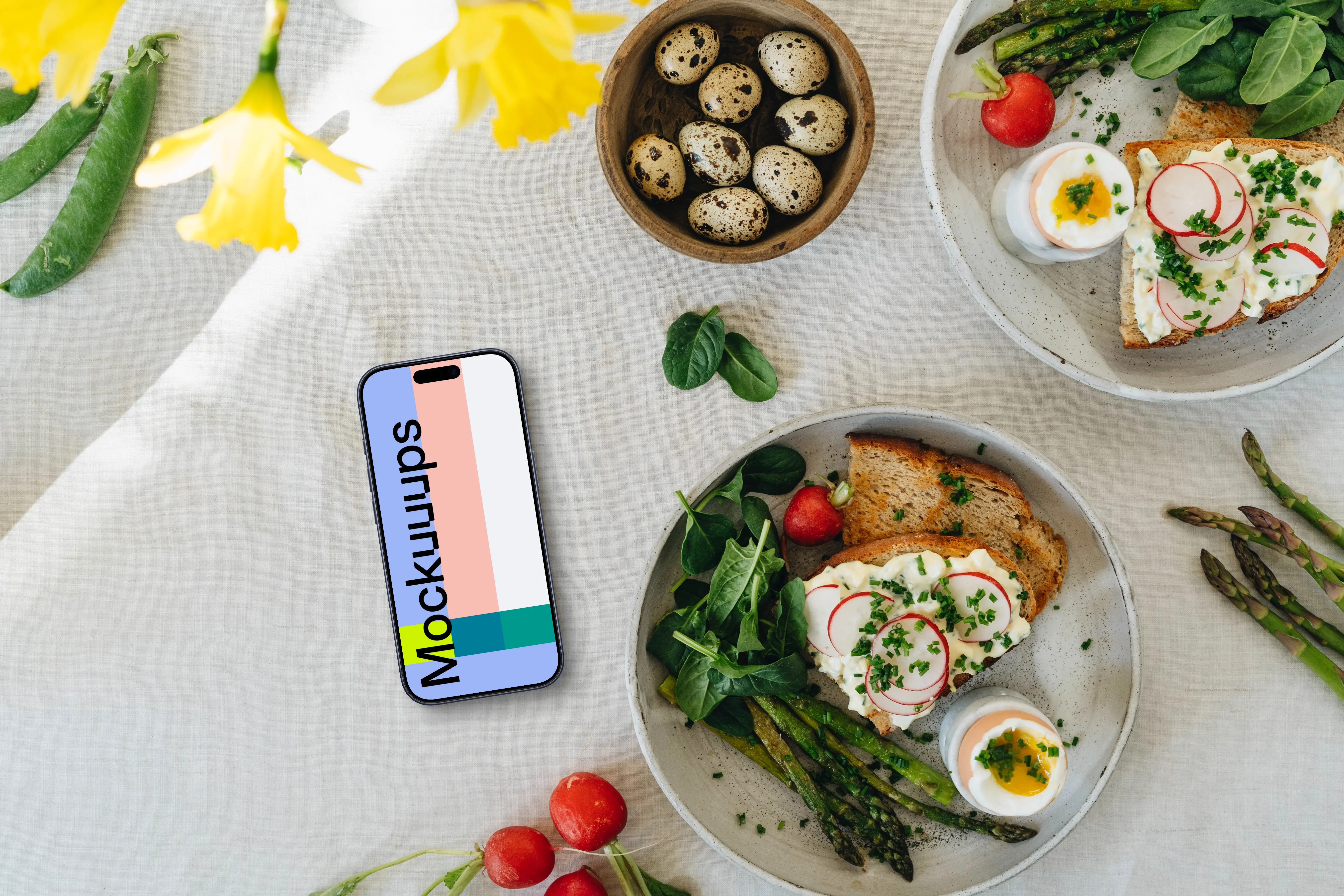Smartphone mockup with Easter snack and yellow flowers