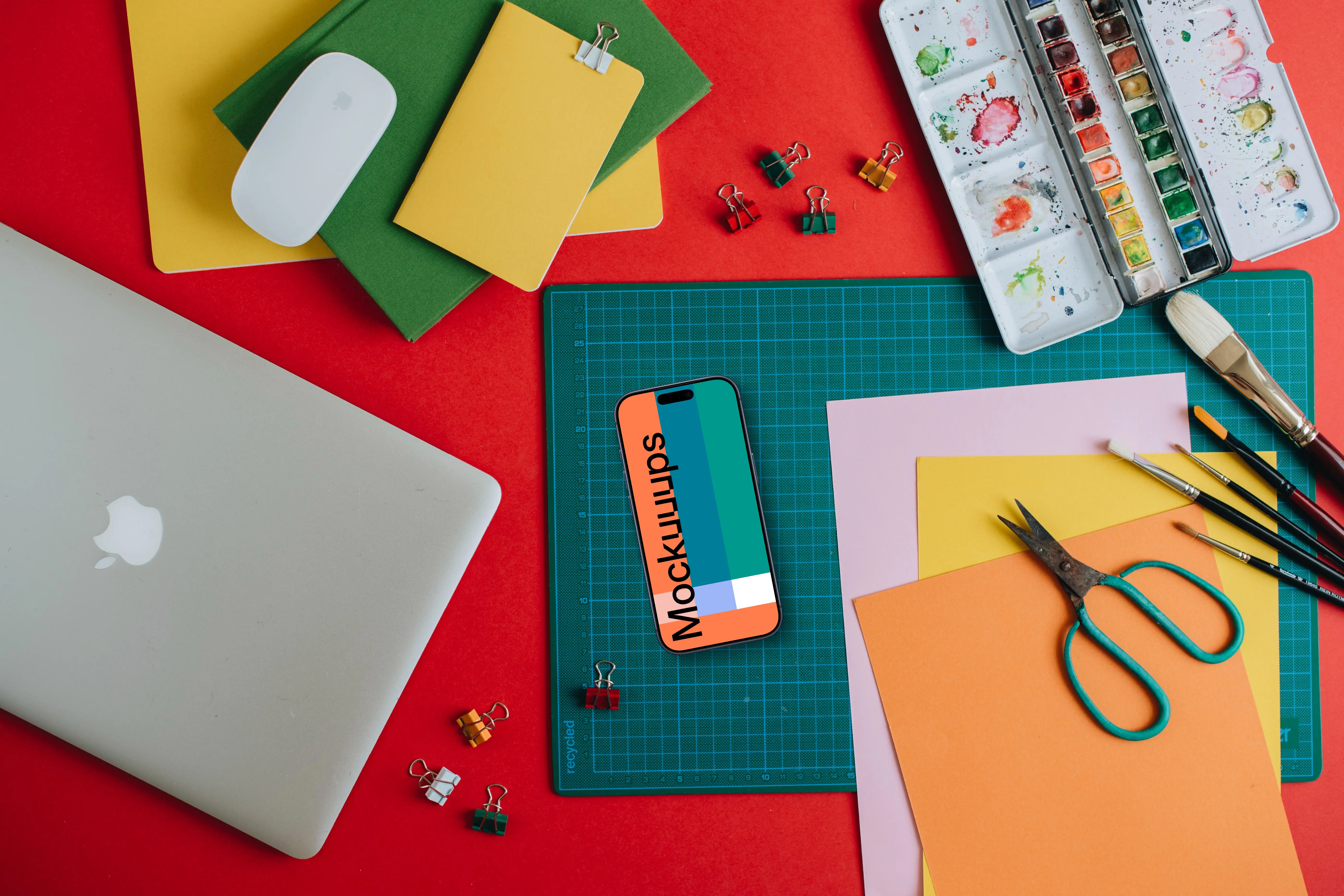 Smartphone mockup with school equipment on the table